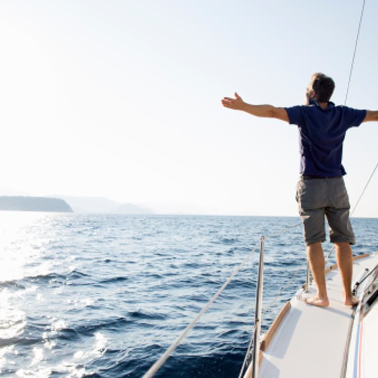 man-yacht-arms-wide-open