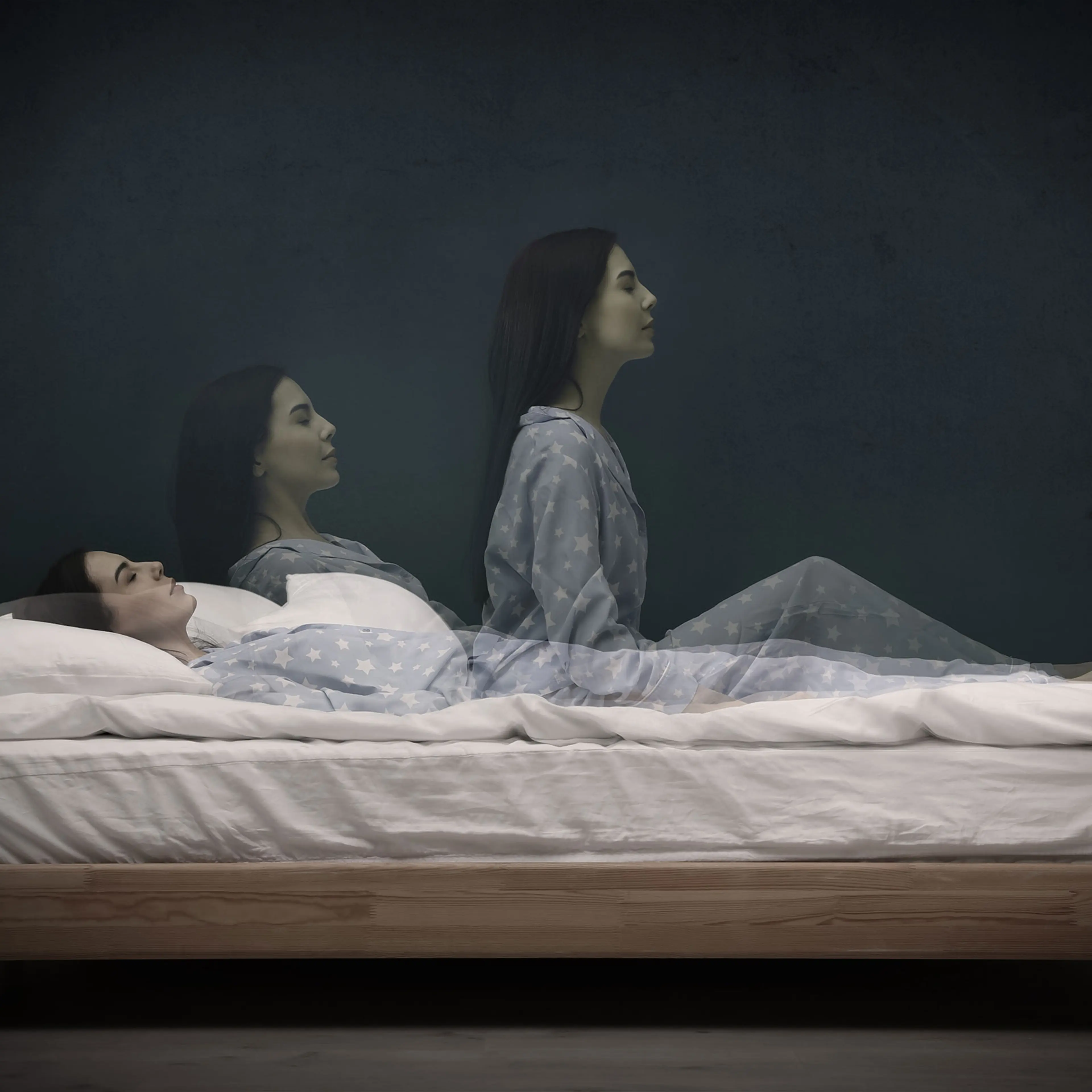 Somnambulist rising from bed near dark wall indoors, multiple exposure. Sleepwalking
