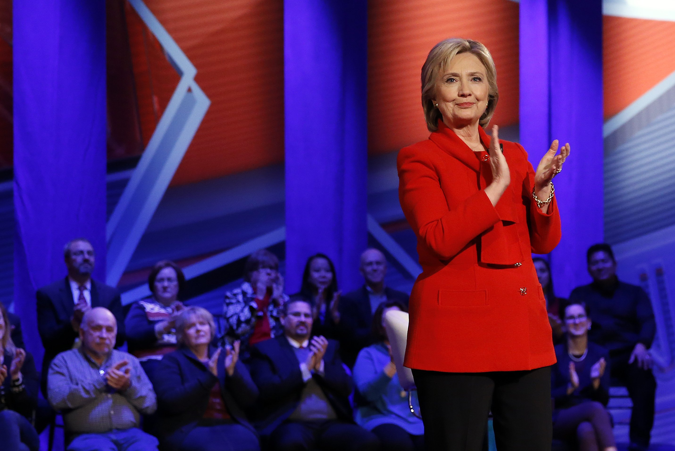 Democratic presidential candidate Hillary Clinton applauds at a town hall in Des Moines, Iowa, Monday, Jan. 25, 2016.