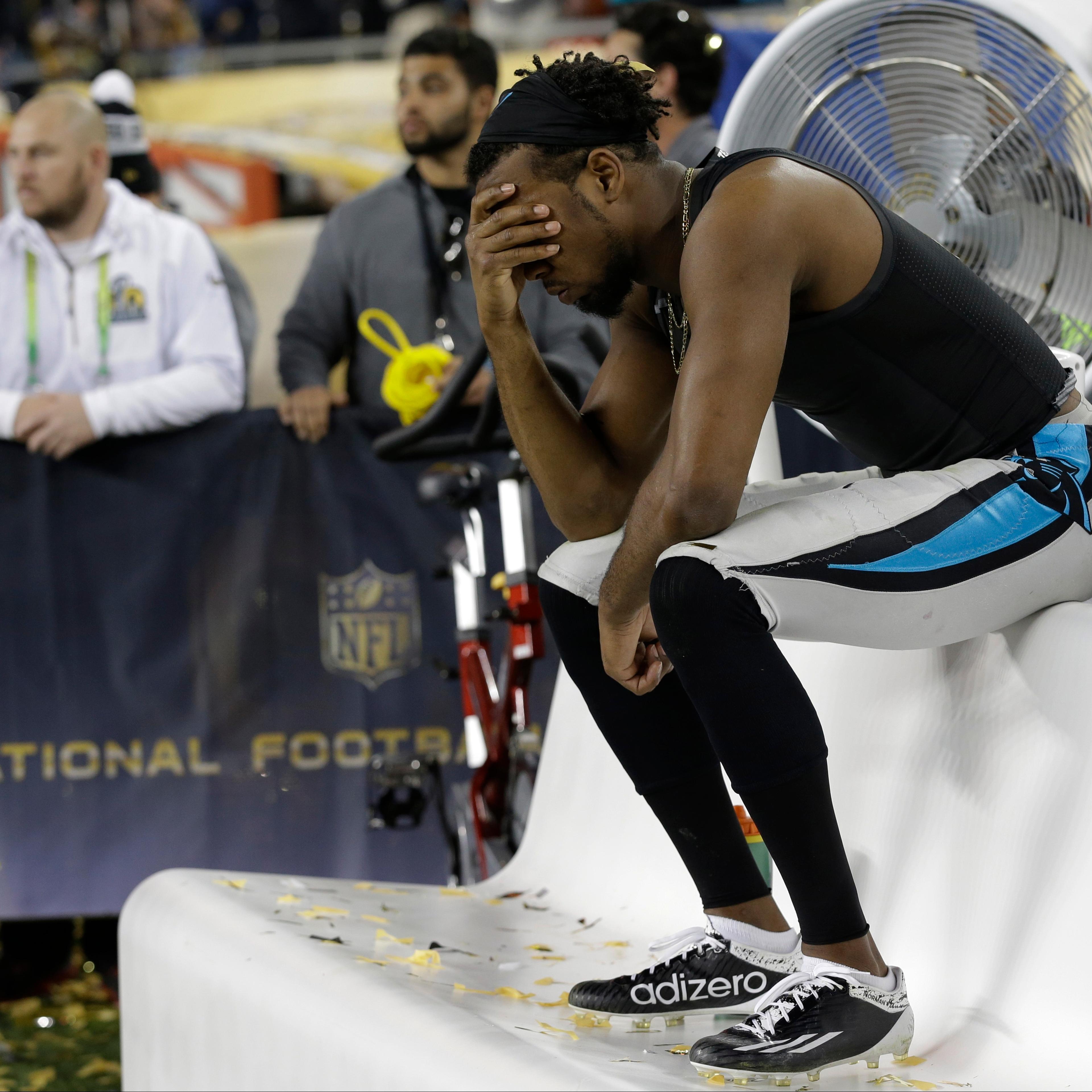 Carolina Panthers Josh Norman (24) sits on the bench after the NFL Super Bowl 50 football game against the Denver Broncos Sunday in Santa Clara, Calif., on Feb. 7, 2016.