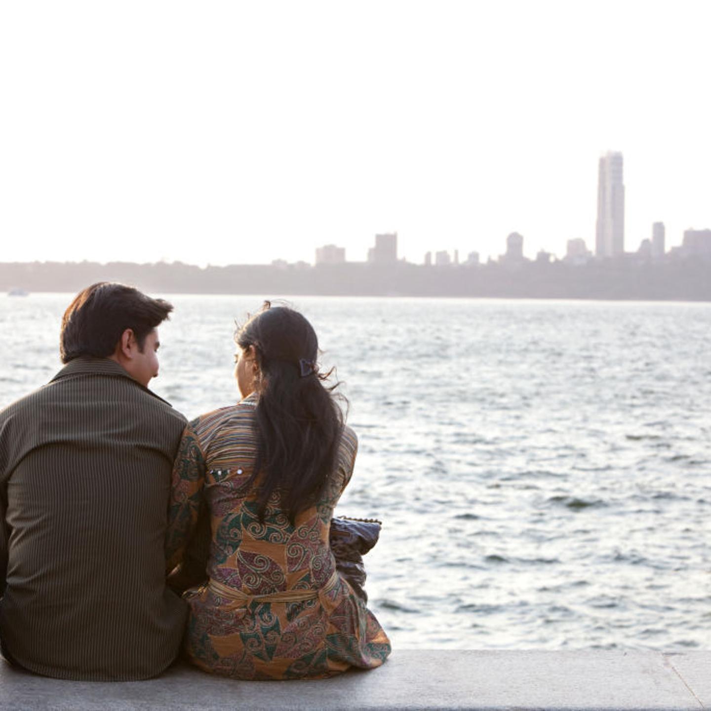 Couple on the seafront at dusk