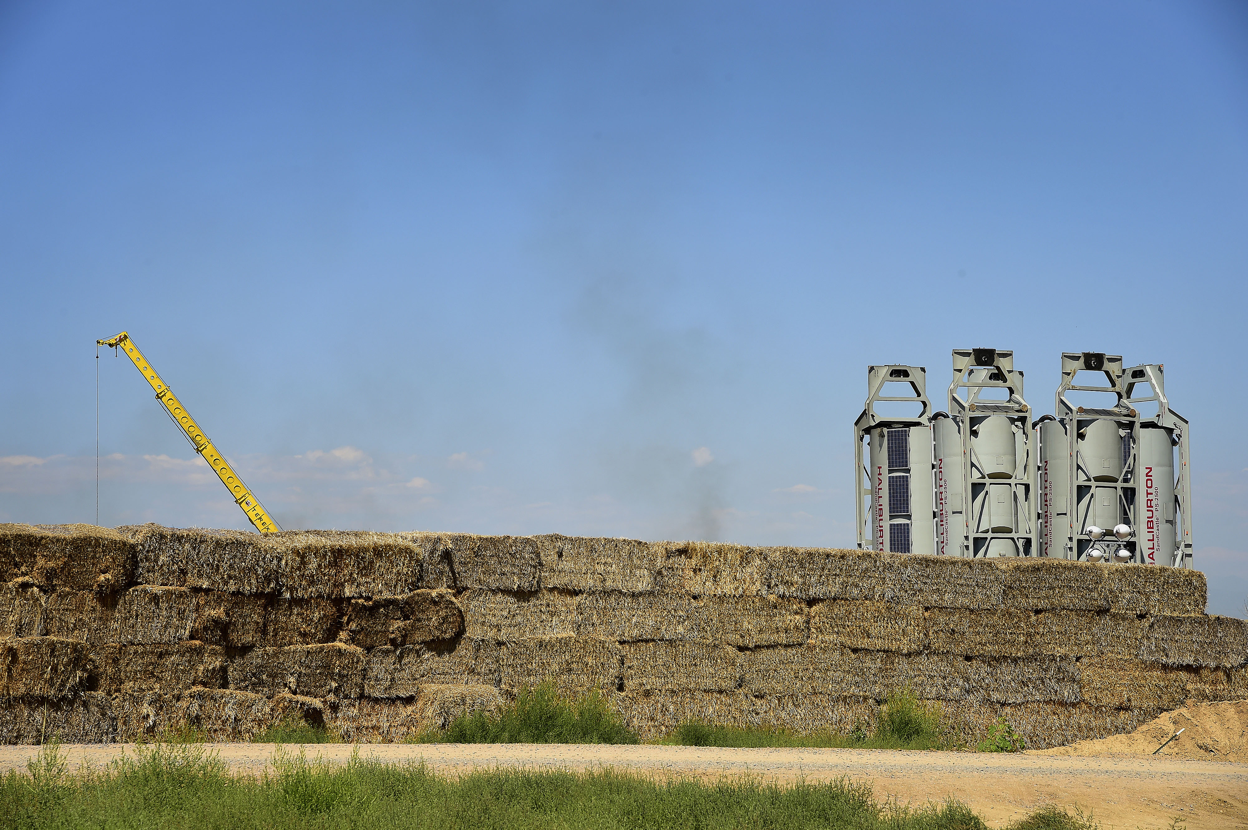 Halliburton Co. "sand castles" stand at an Anadarko Petroleum Corp. hydraulic fracturing (fracking) site north of Dacono, Colorado on Aug. 12, 2014.