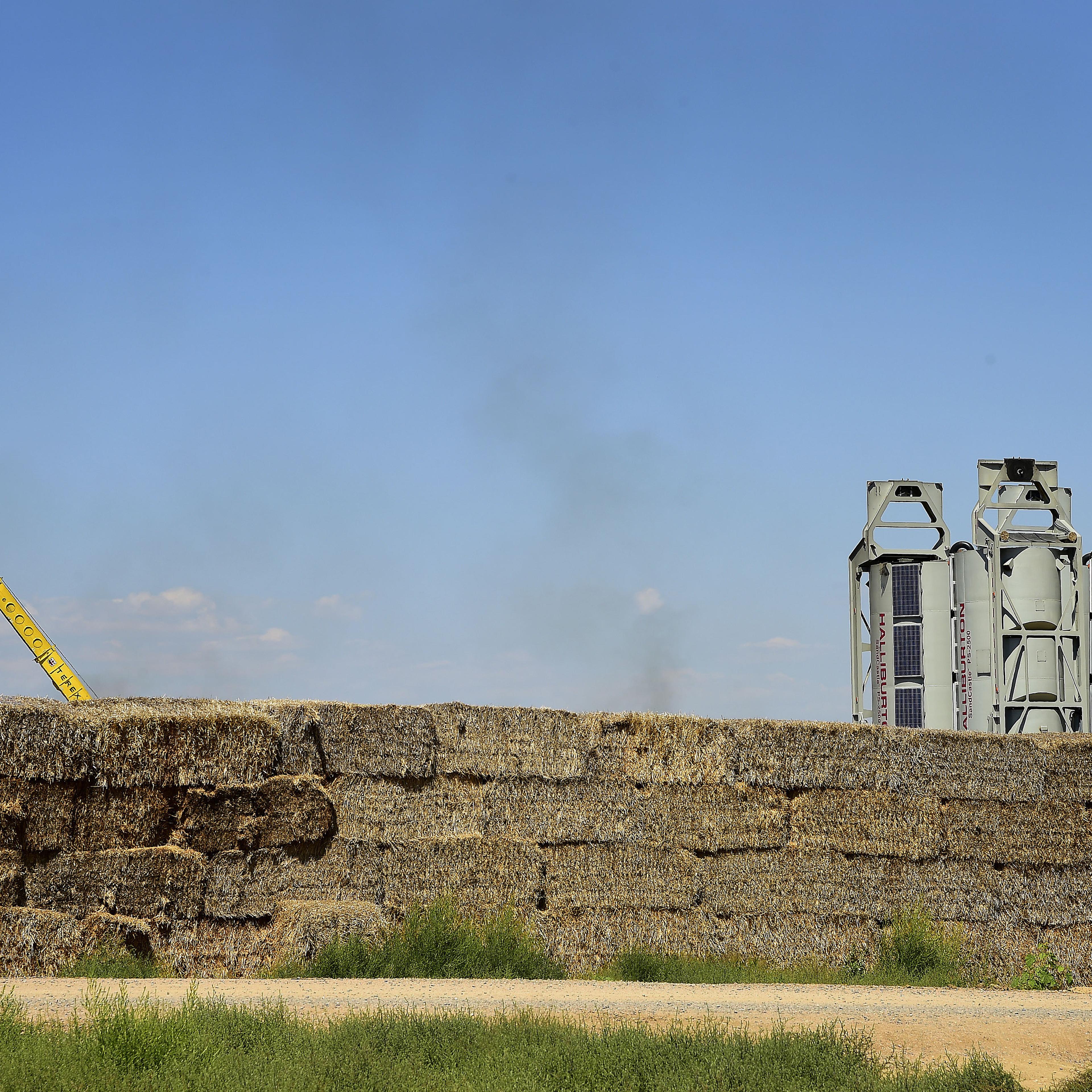 Halliburton Co. "sand castles" stand at an Anadarko Petroleum Corp. hydraulic fracturing (fracking) site north of Dacono, Colorado on Aug. 12, 2014.