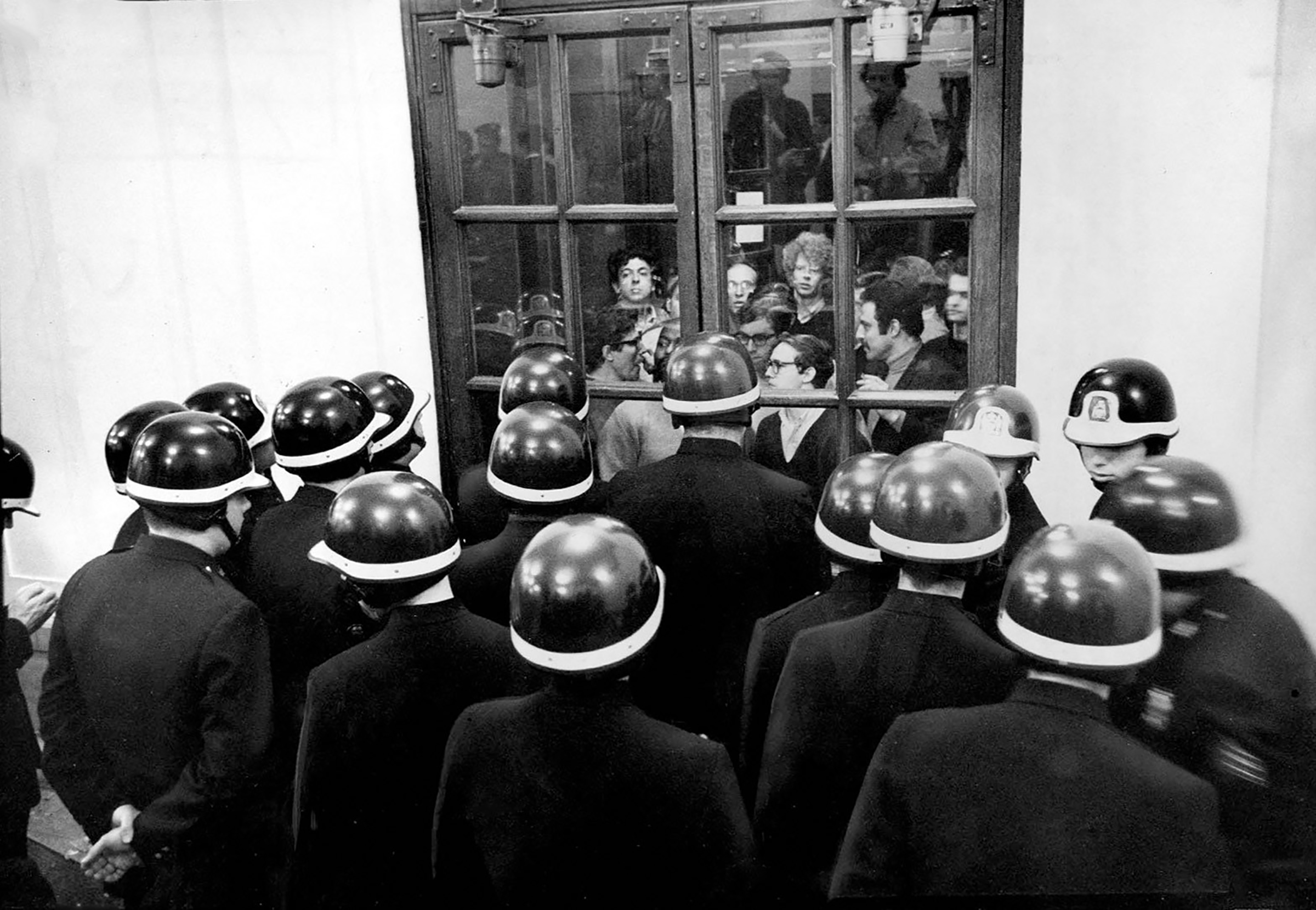 Police force Columbia University students out of Hamilton Hall on May 22, 1968, ending the month-long occupation of the building.