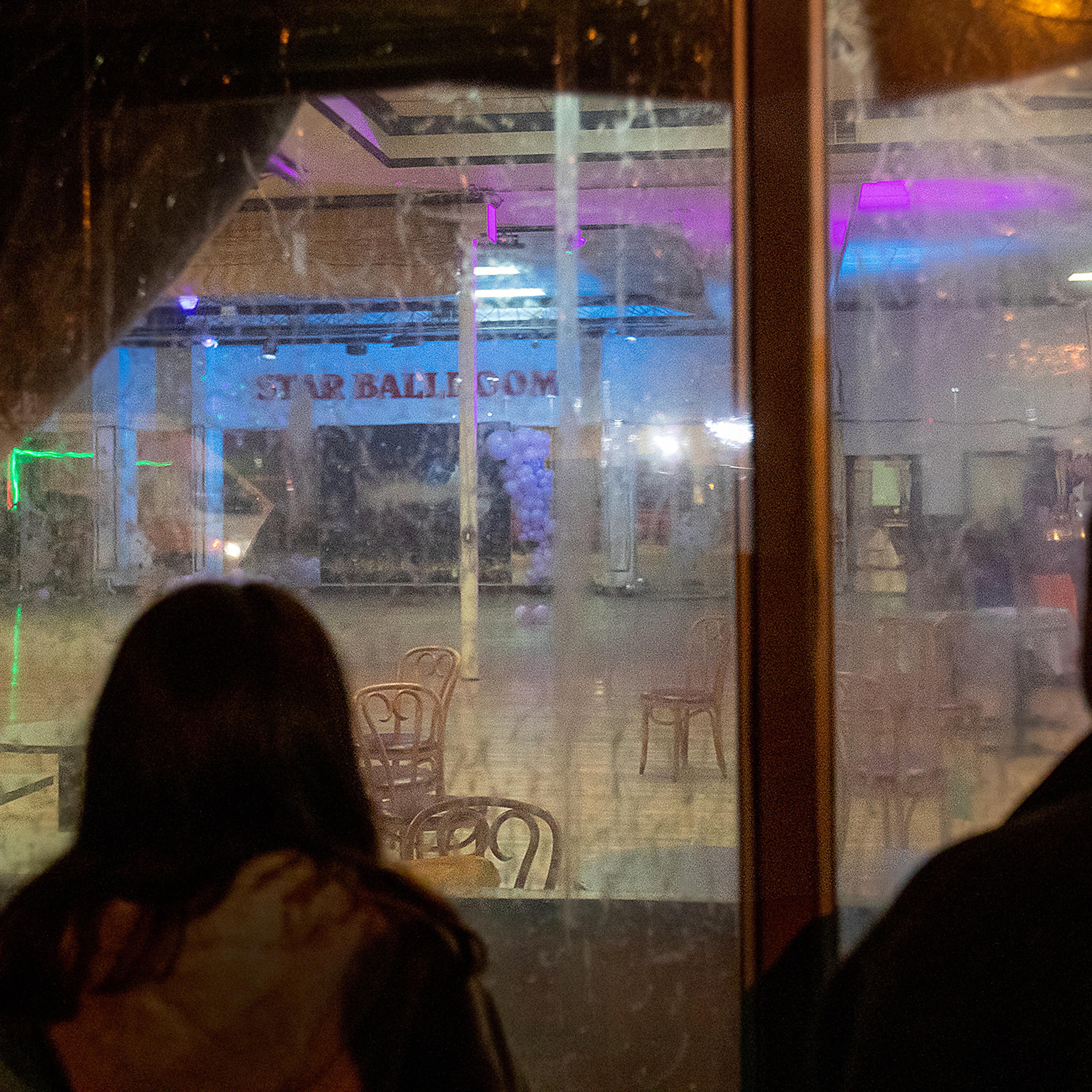 After police tape was taken down, curious bystanders view the crime scene inside the Star Dance Studio Ballroom in Monterey Park, Calif. on Jan. 22.