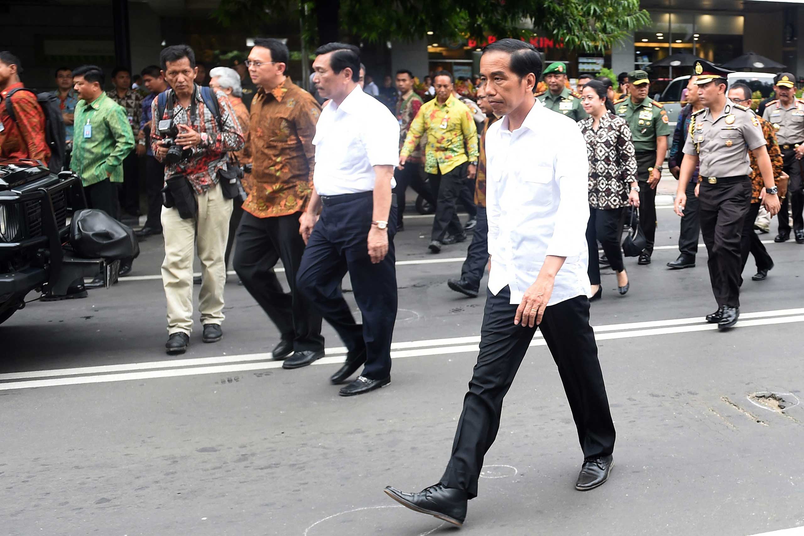 A handout picture provided by the Indonesian Presidential Palace shows President Joko Widodo visiting the blast site near a shopping mall in Jakarta, Indonesia, Jan. 14, 2016. At least seven people, including five suspected assailants, died in bomb blast