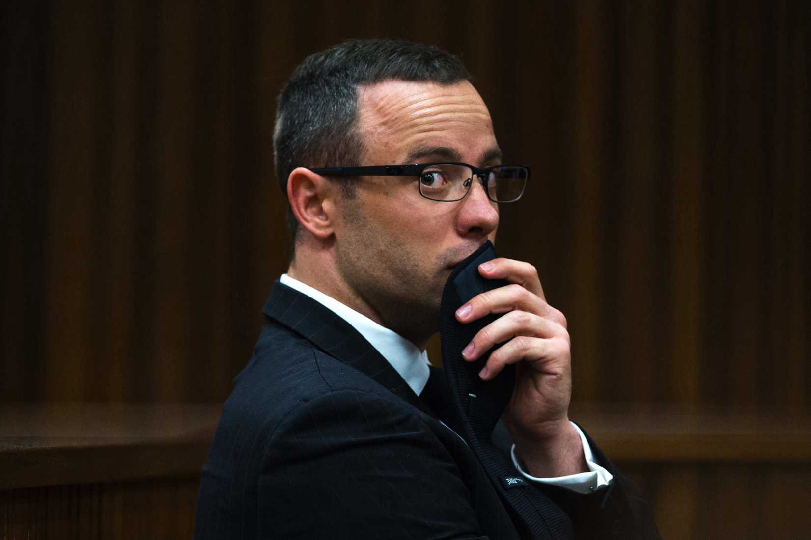 In this Tuesday, May 13, 2014 file photo, murder accused Oscar Pistorius, looks sideways as he listens to psychiatric evidence for his defense, during his ongoing murder trial in Pretoria, South Africa. 