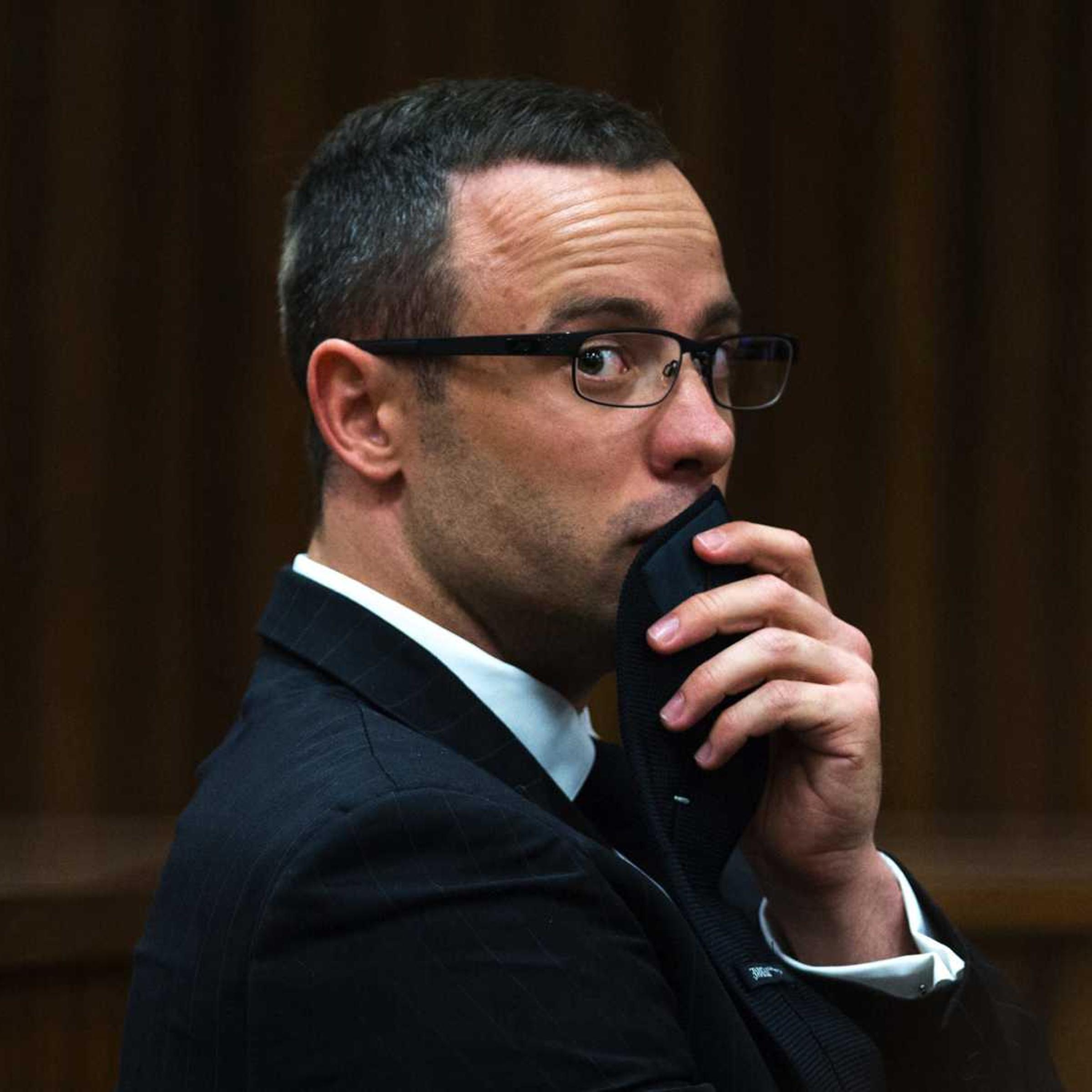 In this Tuesday, May 13, 2014 file photo, murder accused Oscar Pistorius, looks sideways as he listens to psychiatric evidence for his defense, during his ongoing murder trial in Pretoria, South Africa.