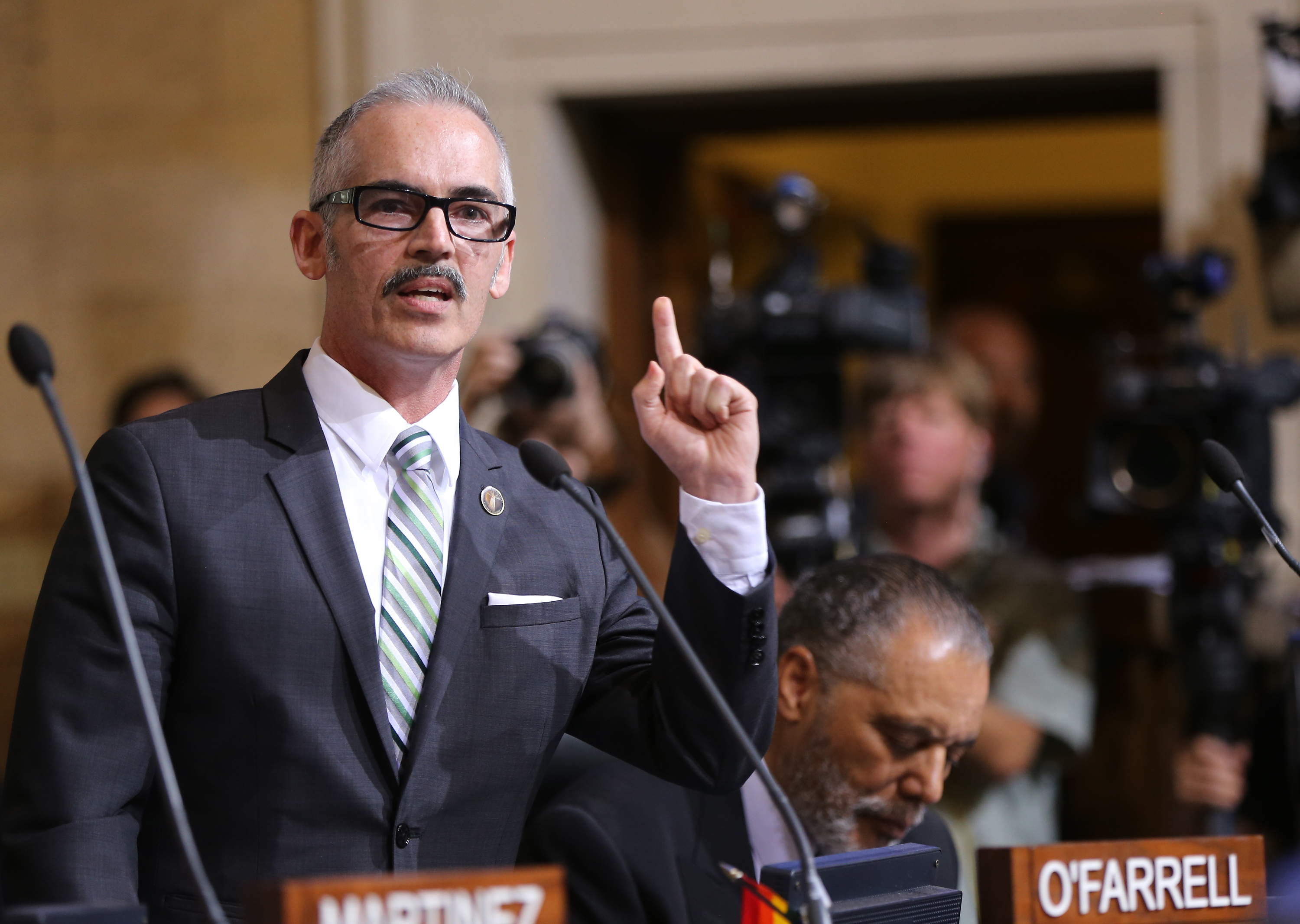 Los Angeles Council member Mitch O'Farrell, left, expresses his support to raise the minimum wage on May 19, 2015, in Los Angeles.