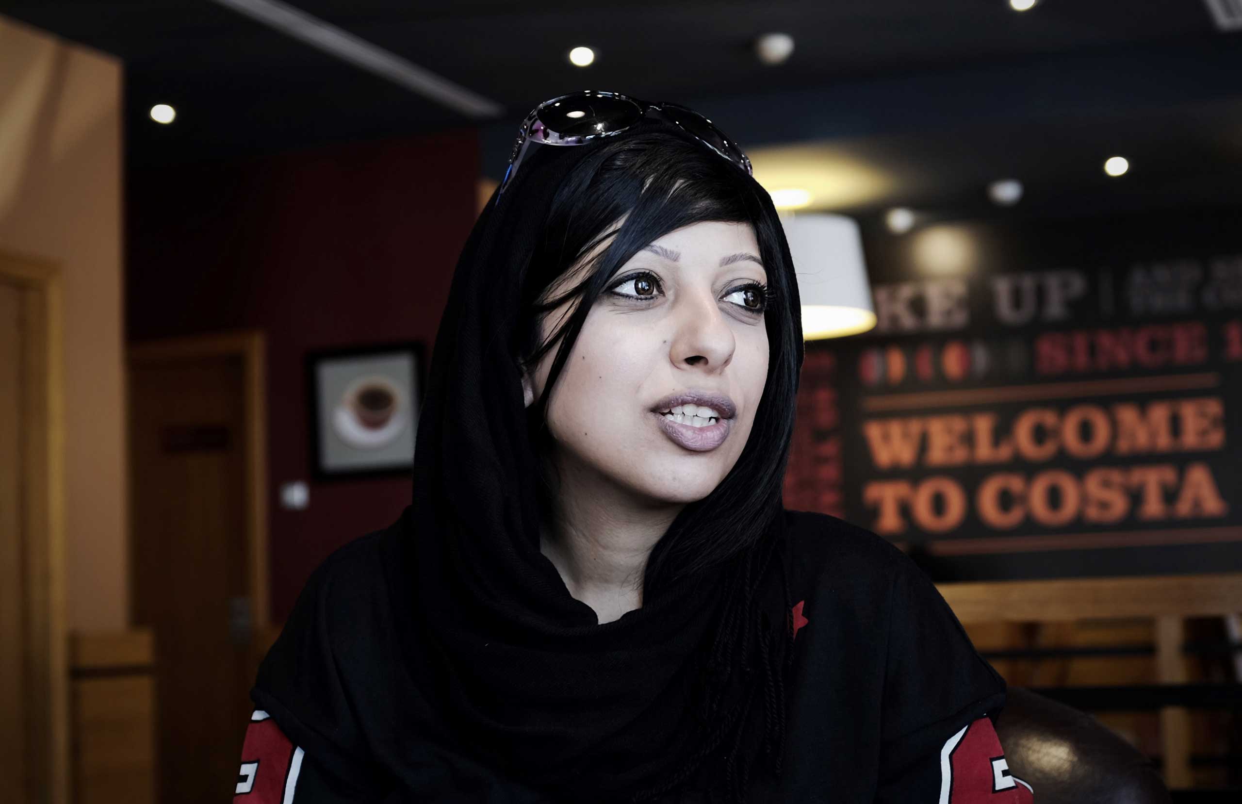 Bahraini human rights activist Zainab al-Khawaja, sister of jailed prominent rights activist Maryam al-Khawaja, sits at a cafe near the Bahrain court building after she was barred by authorities from attending the hearing, in the capital Manama on Sept. 
