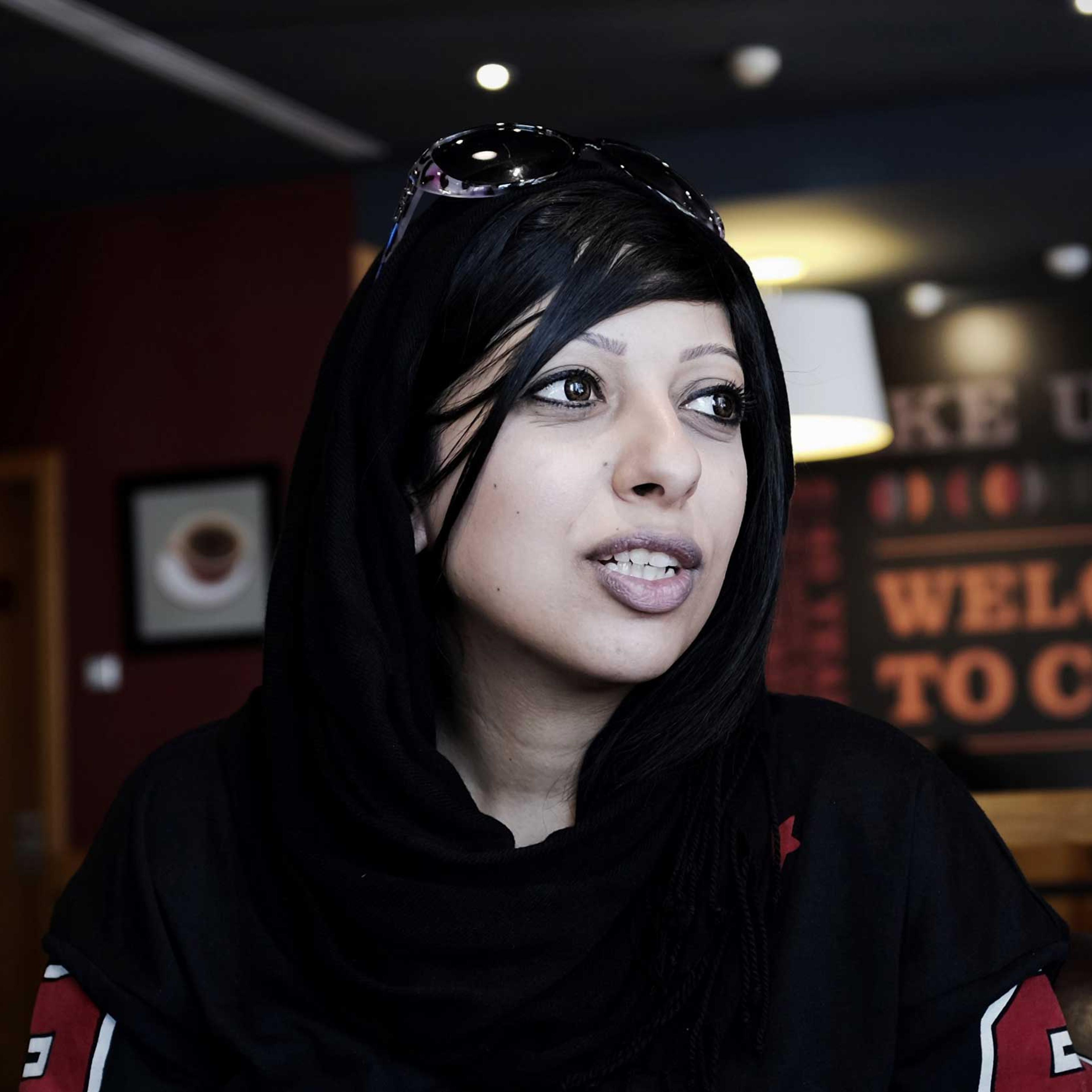 Bahraini human rights activist Zainab al-Khawaja, sister of jailed prominent rights activist Maryam al-Khawaja, sits at a cafe near the Bahrain court building after she was barred by authorities from attending the hearing, in the capital Manama on Sept.