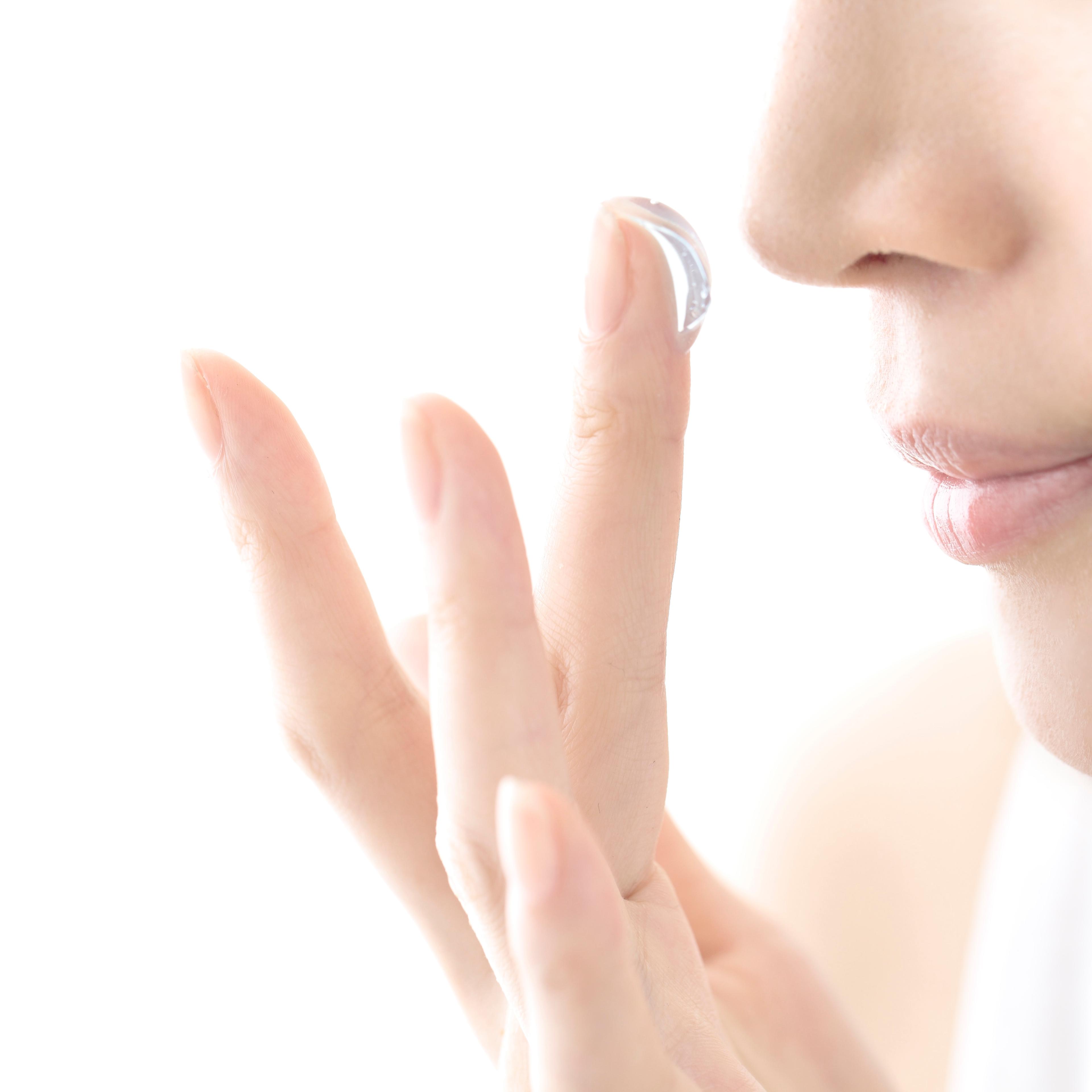 young woman beauty,woman smell the aroma of cream