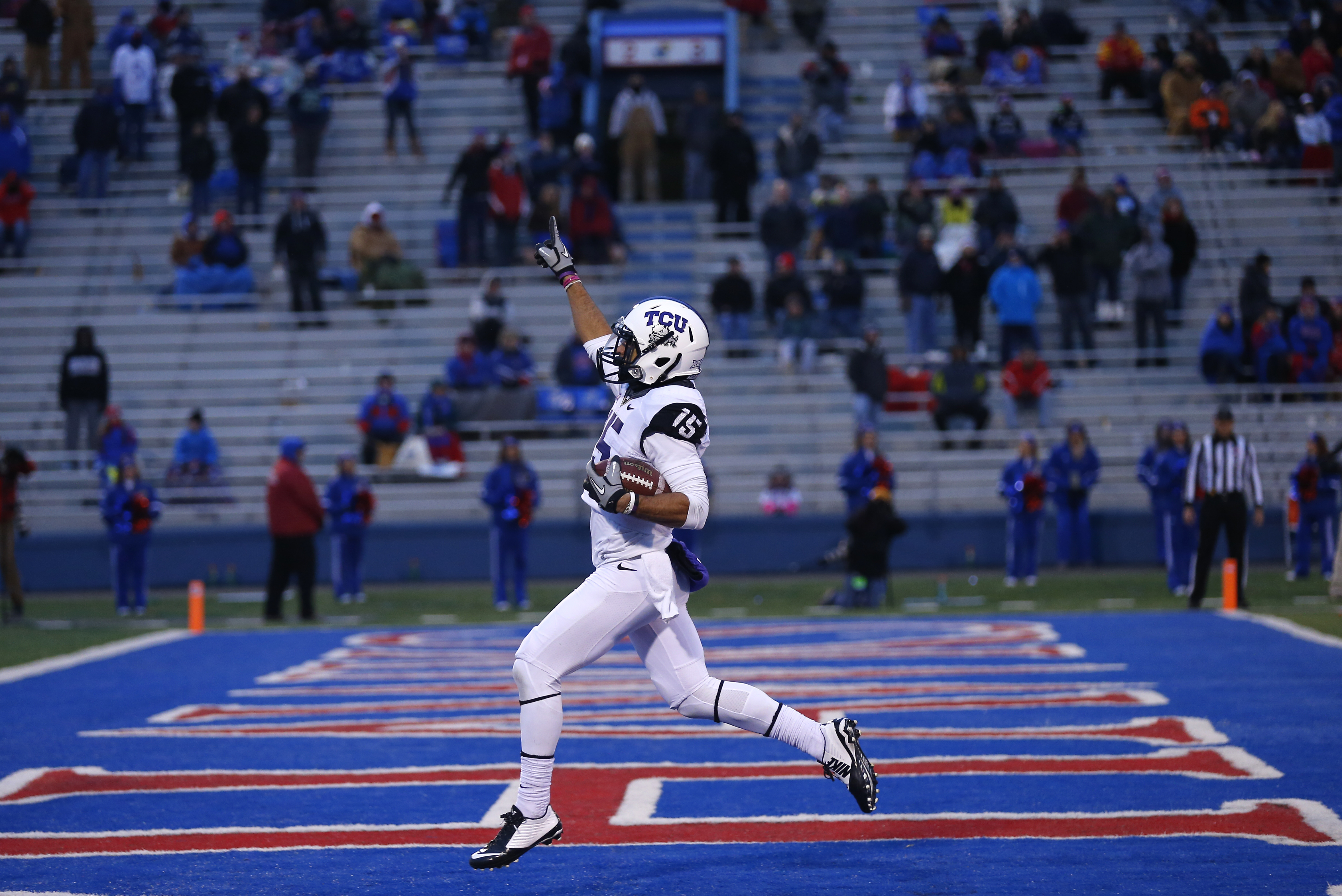 Cameron Echols-Luper of the TCU Horned Frogs celebrates his 69-yard punt return for a touchdown in the third quarter during a game against the Kansas Jayhawks at Memorial Stadium on Nov. 15, 2014 in Lawrence, Kansas.