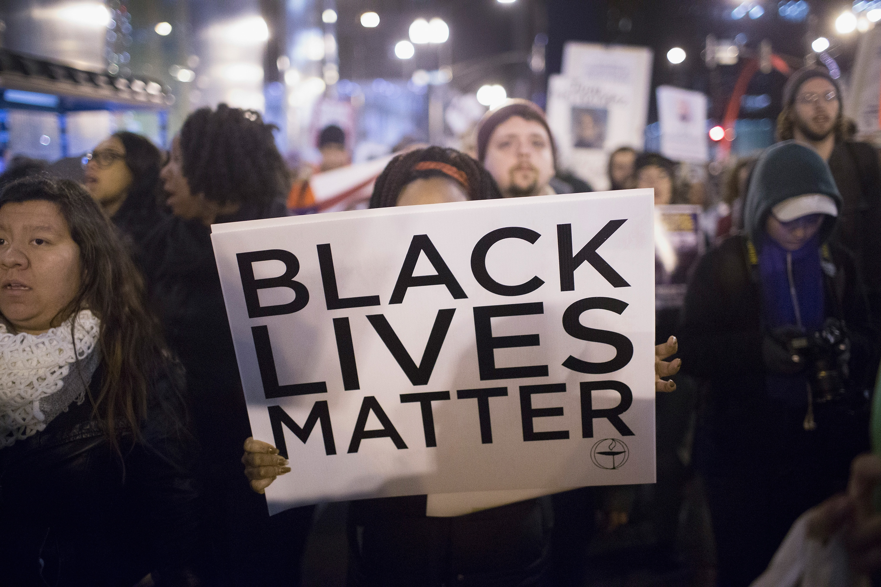 Demonstrators march through downtown calling fror the resignation of Mayor rahm Emanuel in Chicago on Dec. 10, 2015.