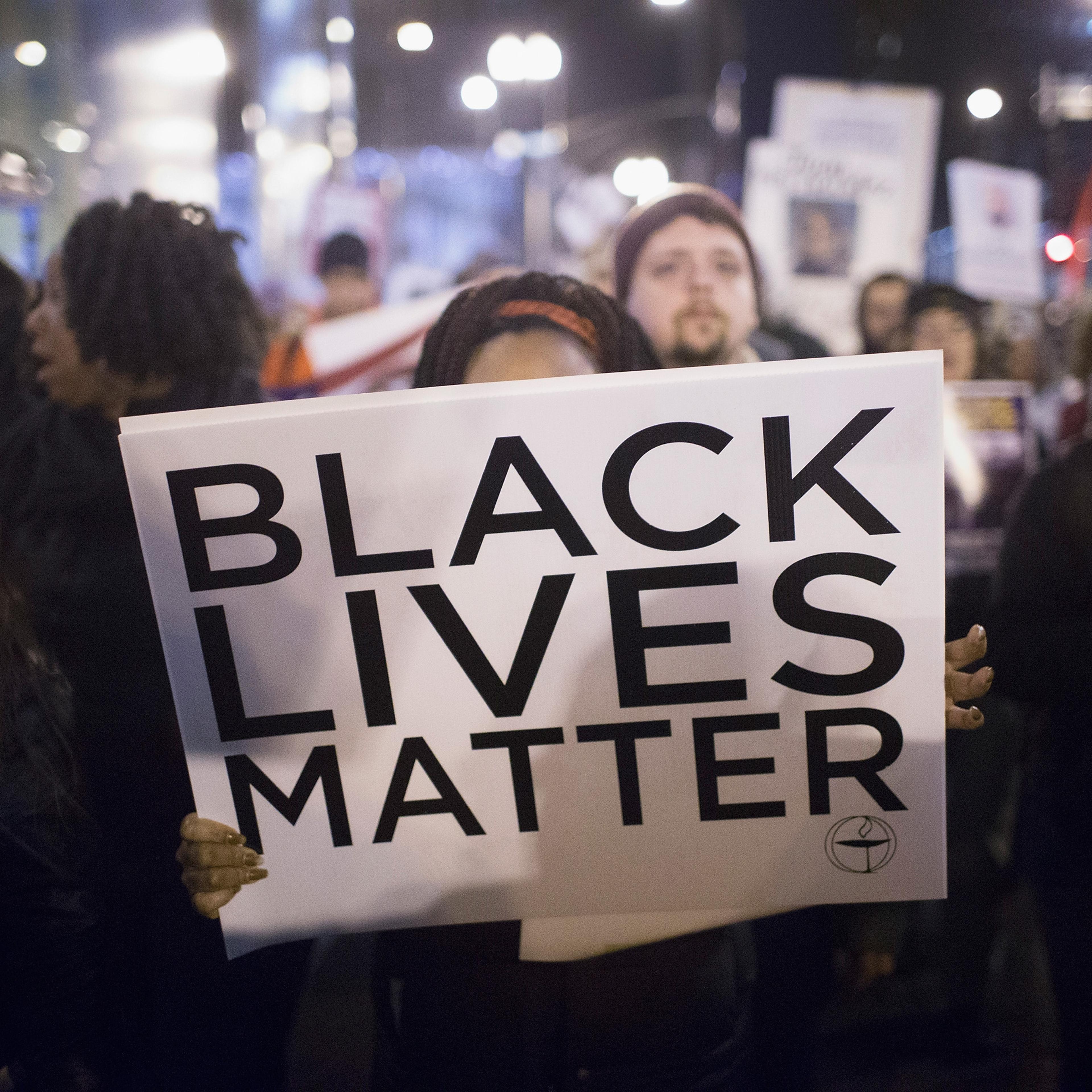 Demonstrators march through downtown calling fror the resignation of Mayor rahm Emanuel in Chicago on Dec. 10, 2015.