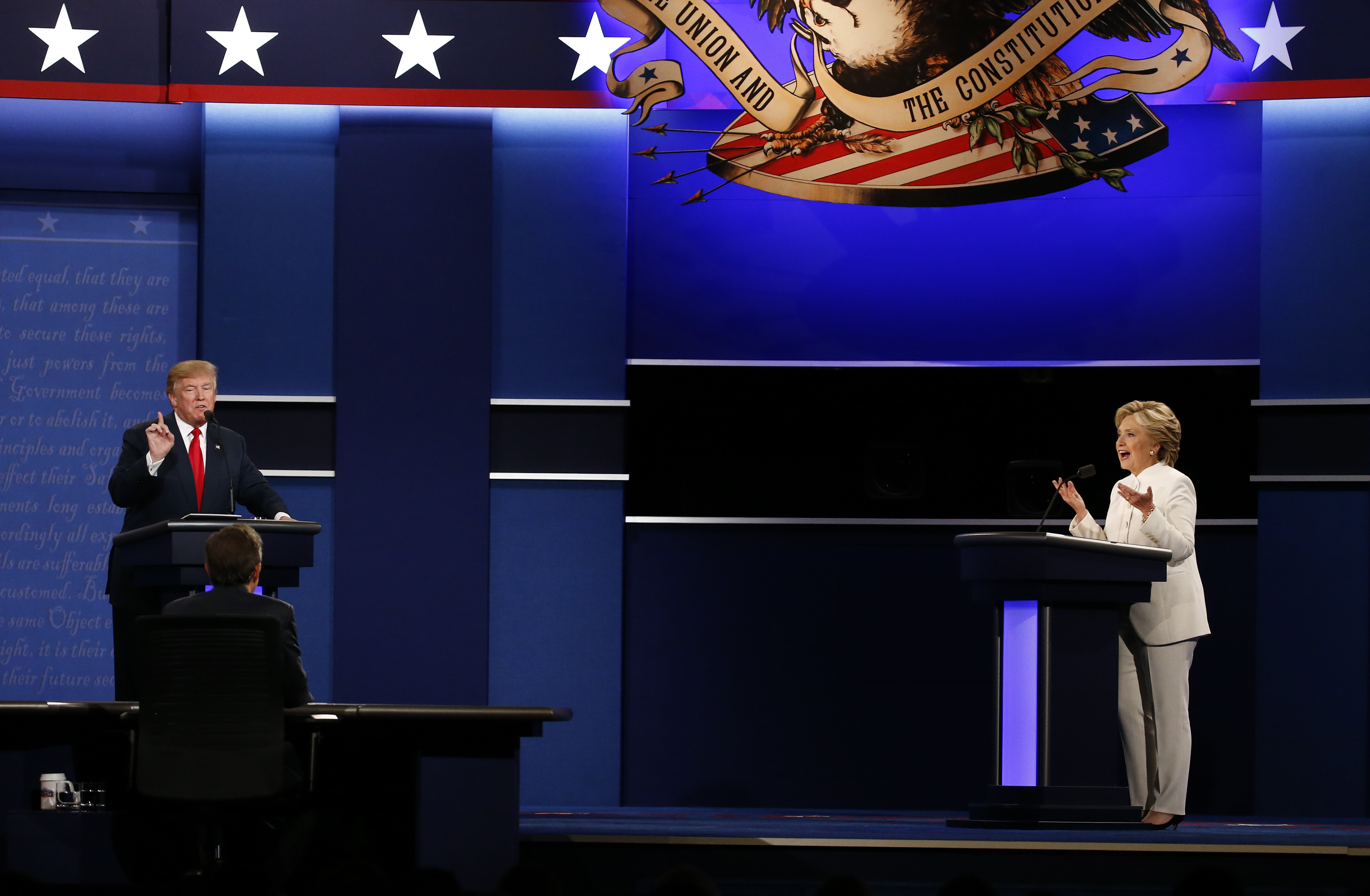Hillary Clinton, 2016 Democratic presidential nominee, speaks as Donald Trump, 2016 Republican presidential nominee, gestures during the third U.S. presidential debate in Las Vegas on Oct. 19, 2016.