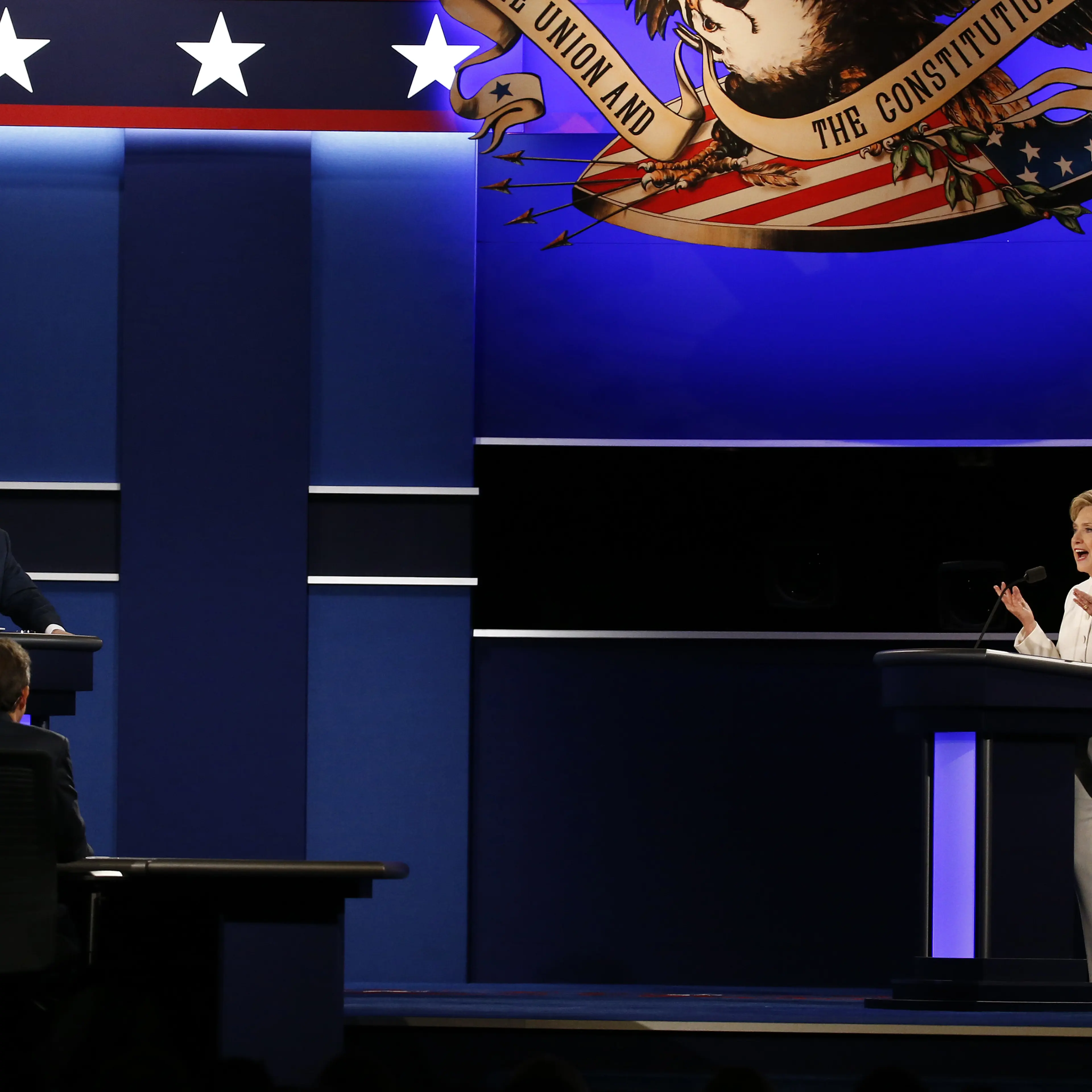 Hillary Clinton, 2016 Democratic presidential nominee, speaks as Donald Trump, 2016 Republican presidential nominee, gestures during the third U.S. presidential debate in Las Vegas on Oct. 19, 2016.
