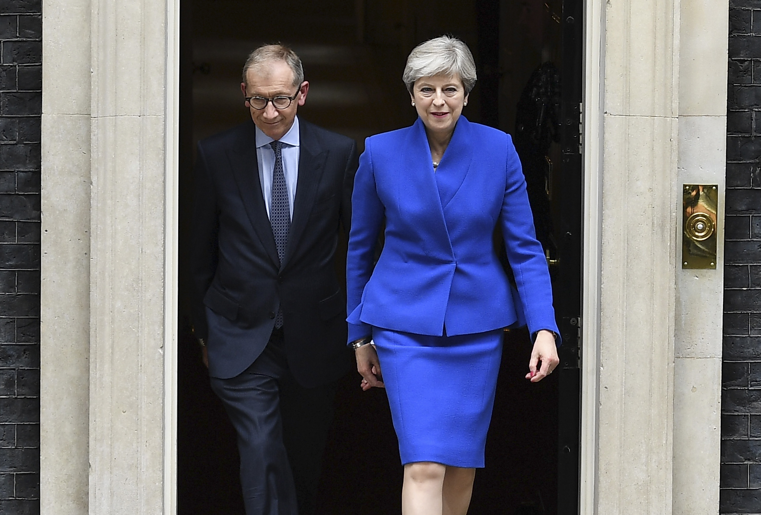 Prime Minister Theresa May leaves Downing Street with her husband Philip to go to Buckingham Palace where she will seek the Queen's permission to form a UK government on June 9, 2017 in London, England.