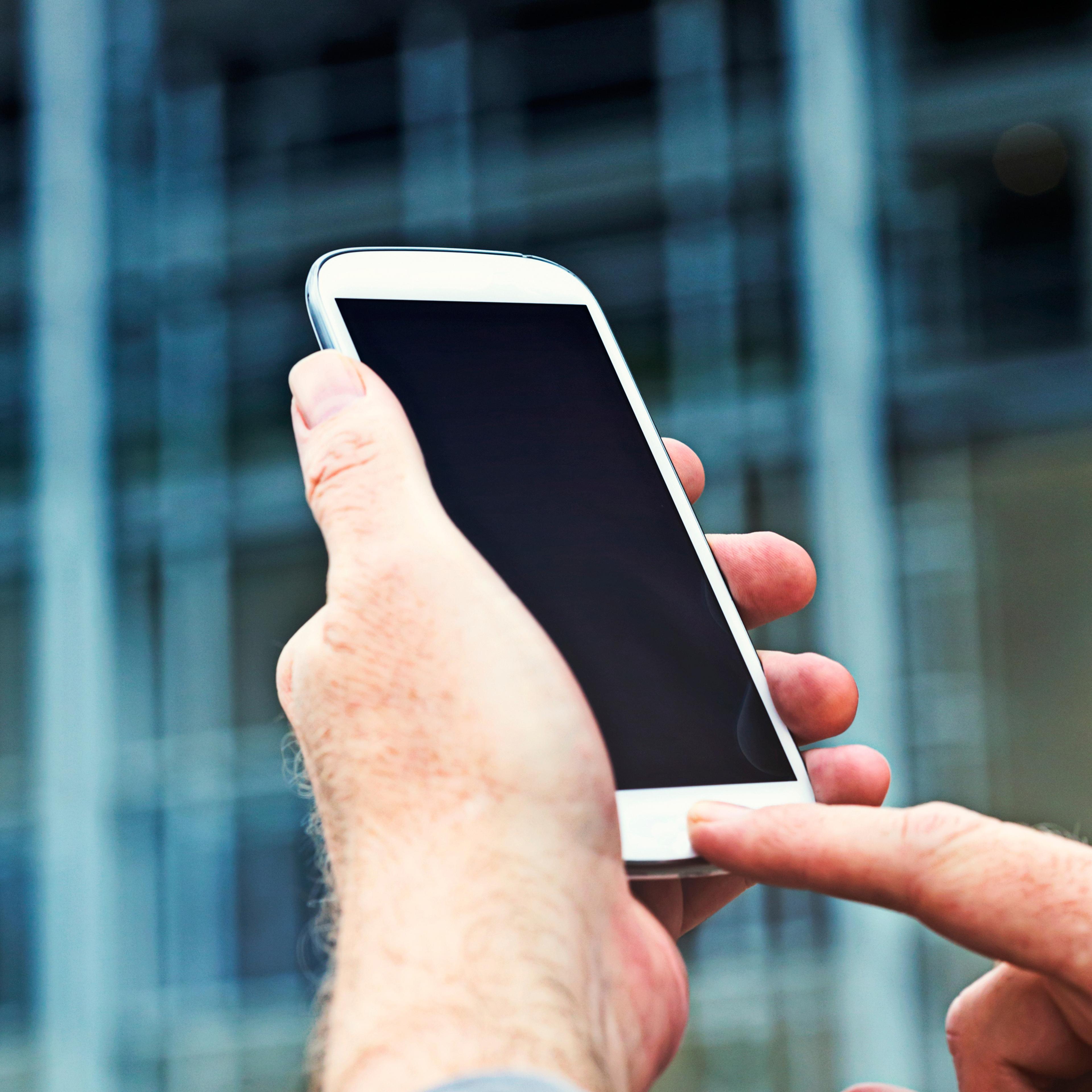 man-holding-android-phone