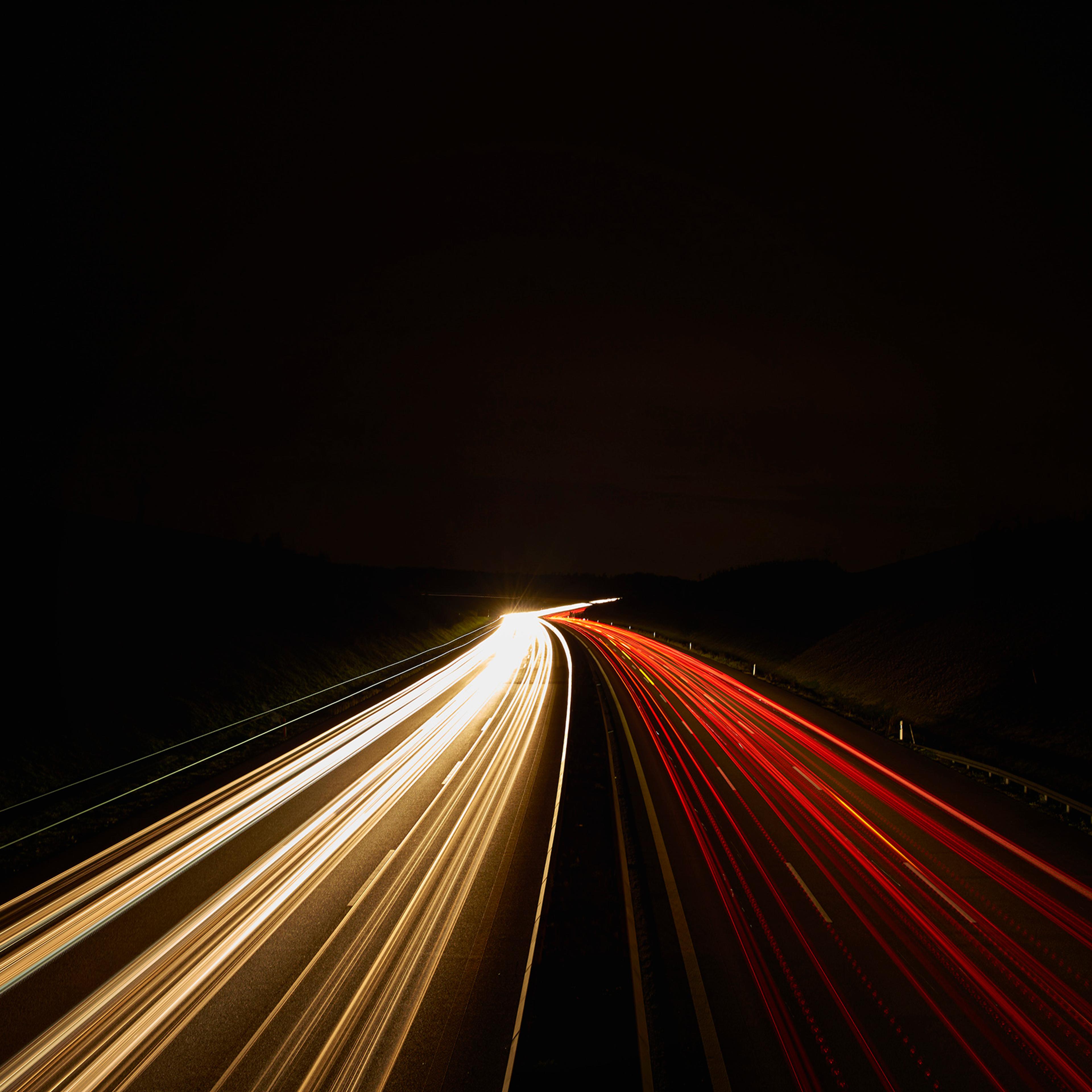 Germany, red and white lighttrails on freeway by night, long exposure