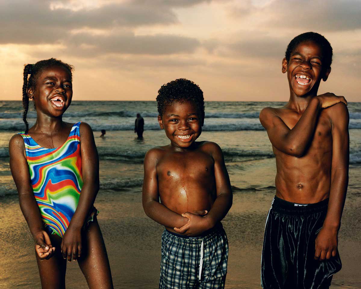 Abir, Munir, And Sullman Jaffa, 2002. From Testimony Series."When I made this photo in 2002 it felt like the beach is where the country came to escape the daily turmoil. This remains one of my favorite images I made at the beach because of the unbridled 