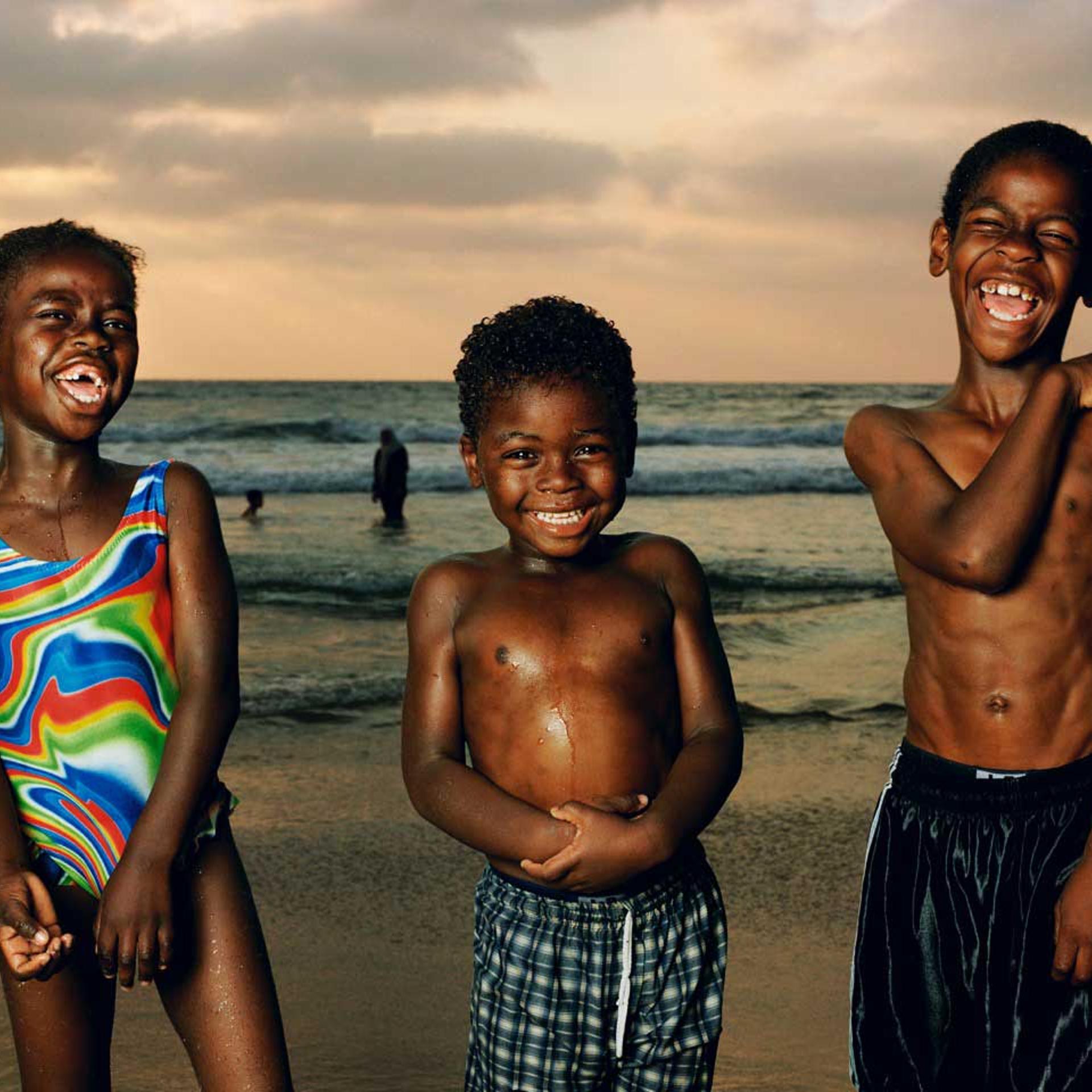 Abir, Munir, And Sullman Jaffa, 2002. From Testimony Series."When I made this photo in 2002 it felt like the beach is where the country came to escape the daily turmoil. This remains one of my favorite images I made at the beach because of the unbridled