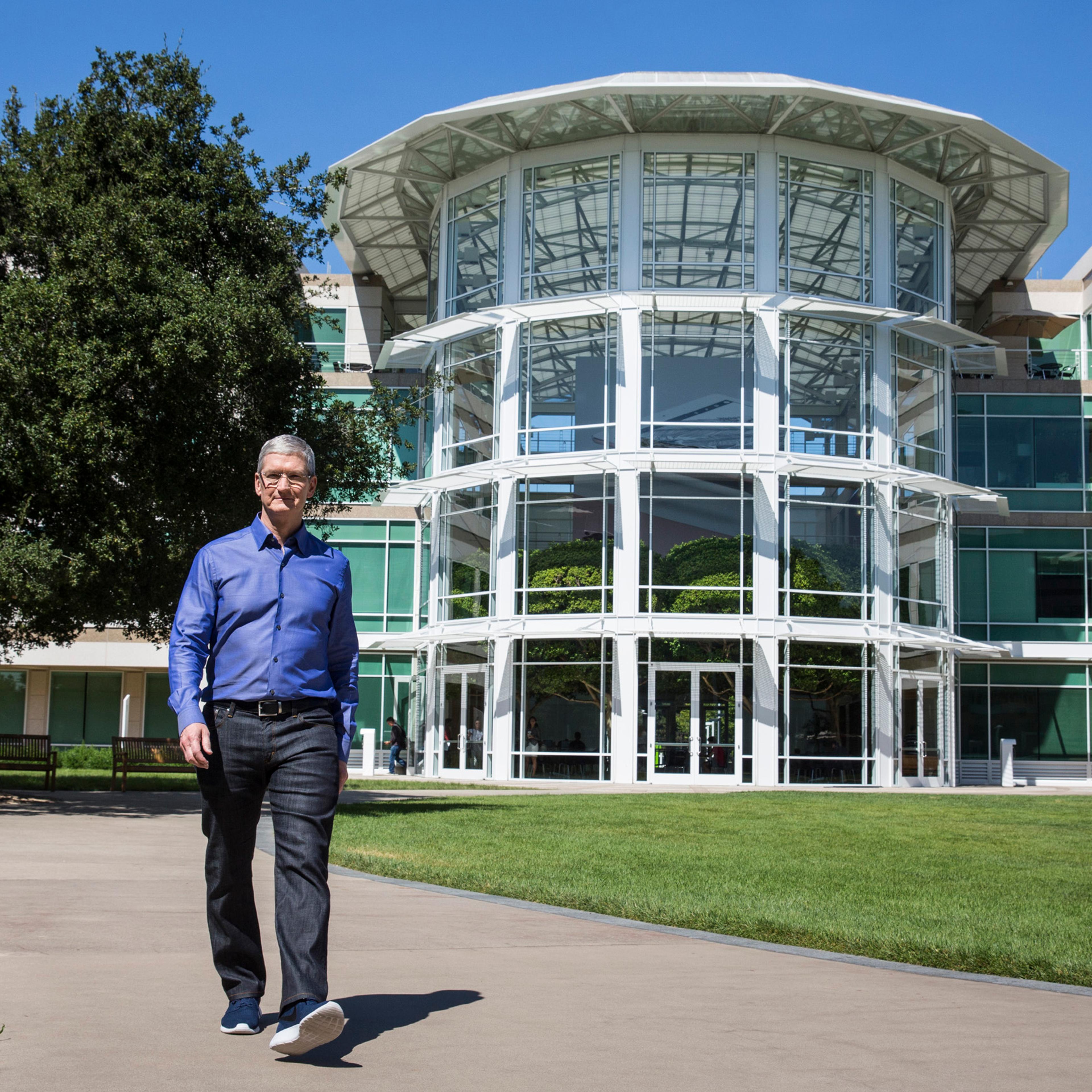 Apple CEO Tim Cook walks through Apple's global headquarters during a photo shoot in Cupertino, Calif. on July 28, 2016.
