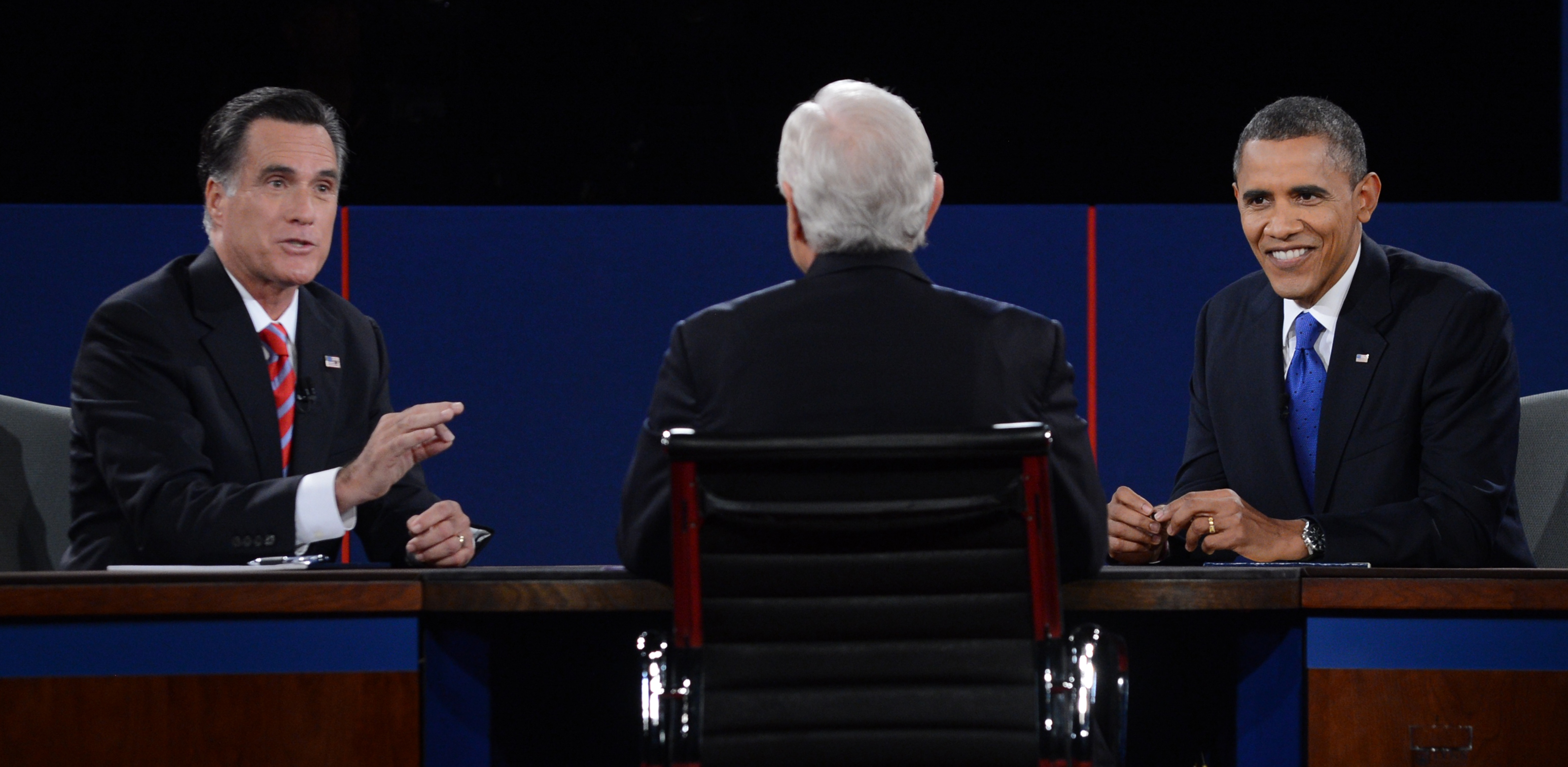 US President Barack Obama and Republican Presidential candidate Mitt Romney participate in the third and final presidential debate, moderated by Bob Schieffer (C) of CBS, at Lynn University in Boca Raton, Florida, Oct. 22, 2012.