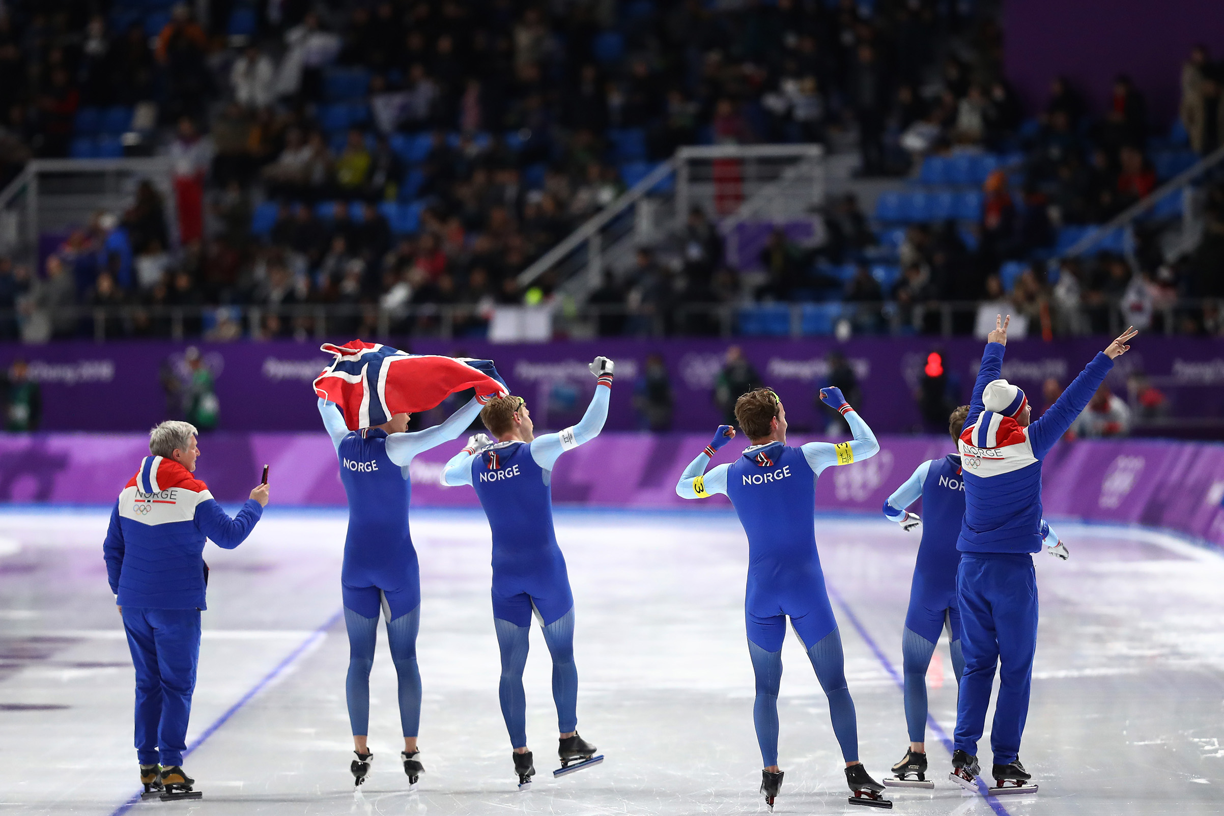 Havard Bokko, Sindre Henriksen, Simen Spieler Nilsen and Sverre Lunde Pedersen of Norway celebrate after winning the gold medal during the Speed Skating Men's Team Pursuit Final on Feb. 21, 2018.