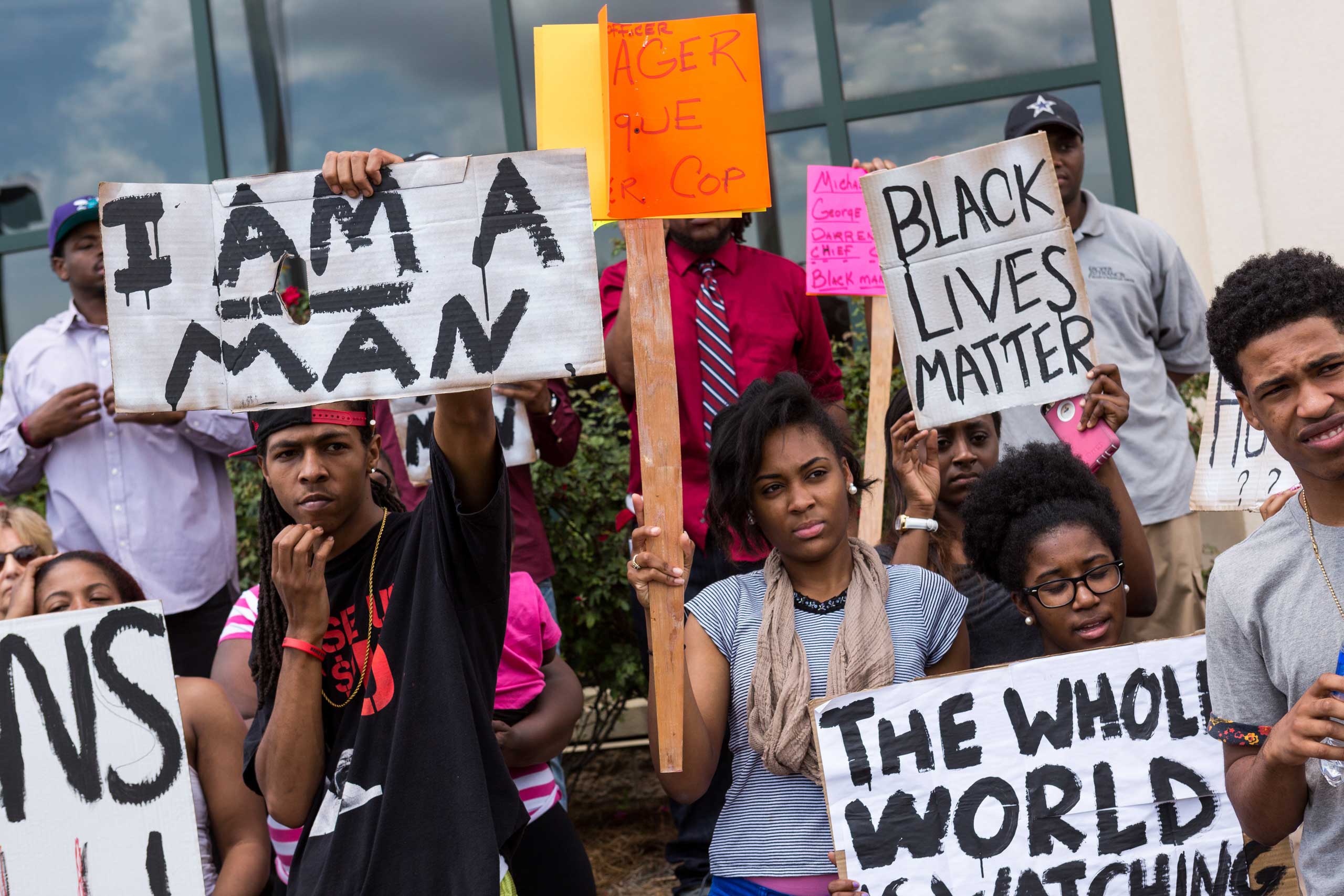 People participate in a rally to protest the death of Walter Scott, who was killed by police in a shooting, outside City Hall in North Charleston, S.C., on April 8, 2015.
