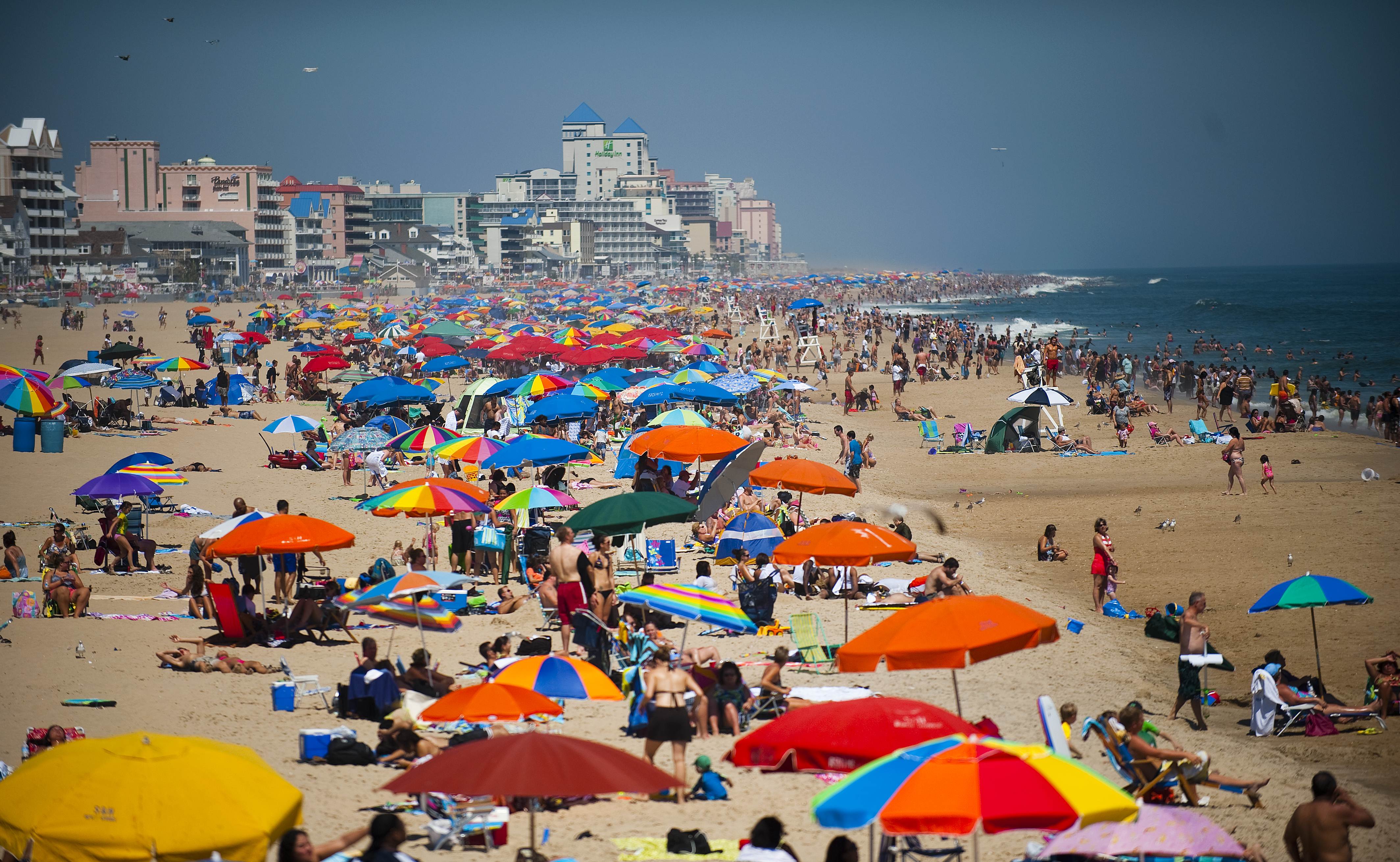 People line the beach in Ocean City, Mar