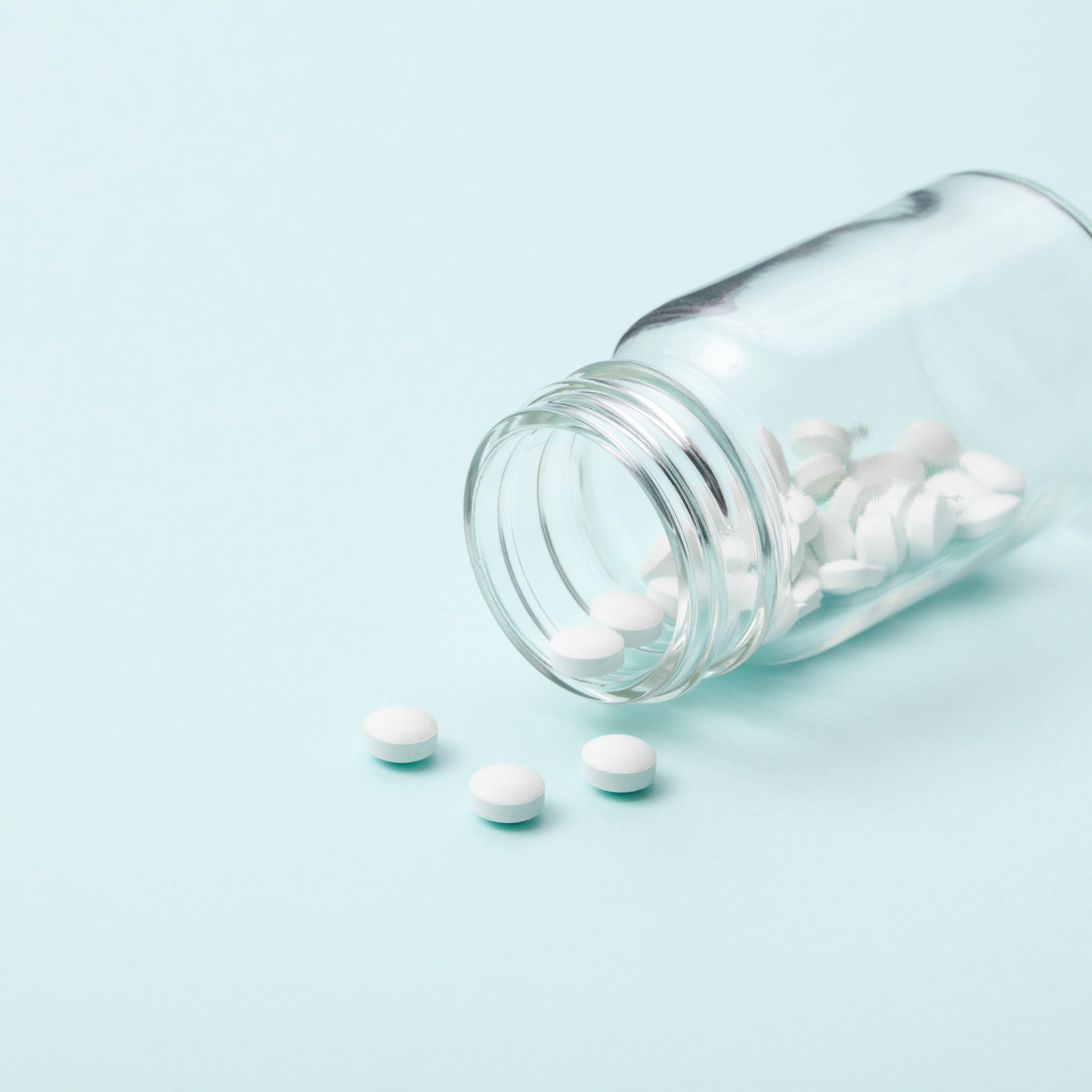 White tablet with a glass bottle TIME health stock