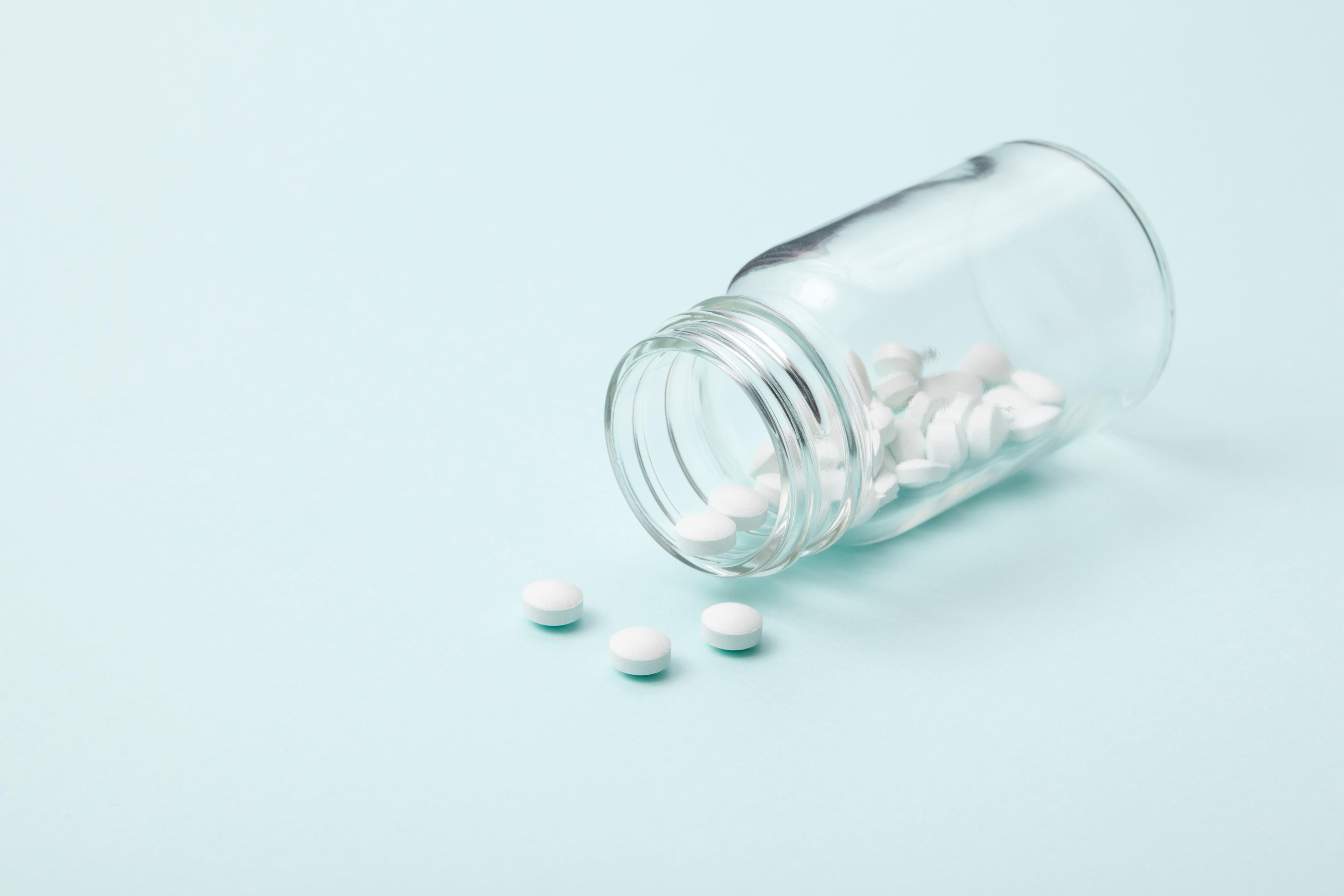 White tablet with a glass bottle TIME health stock