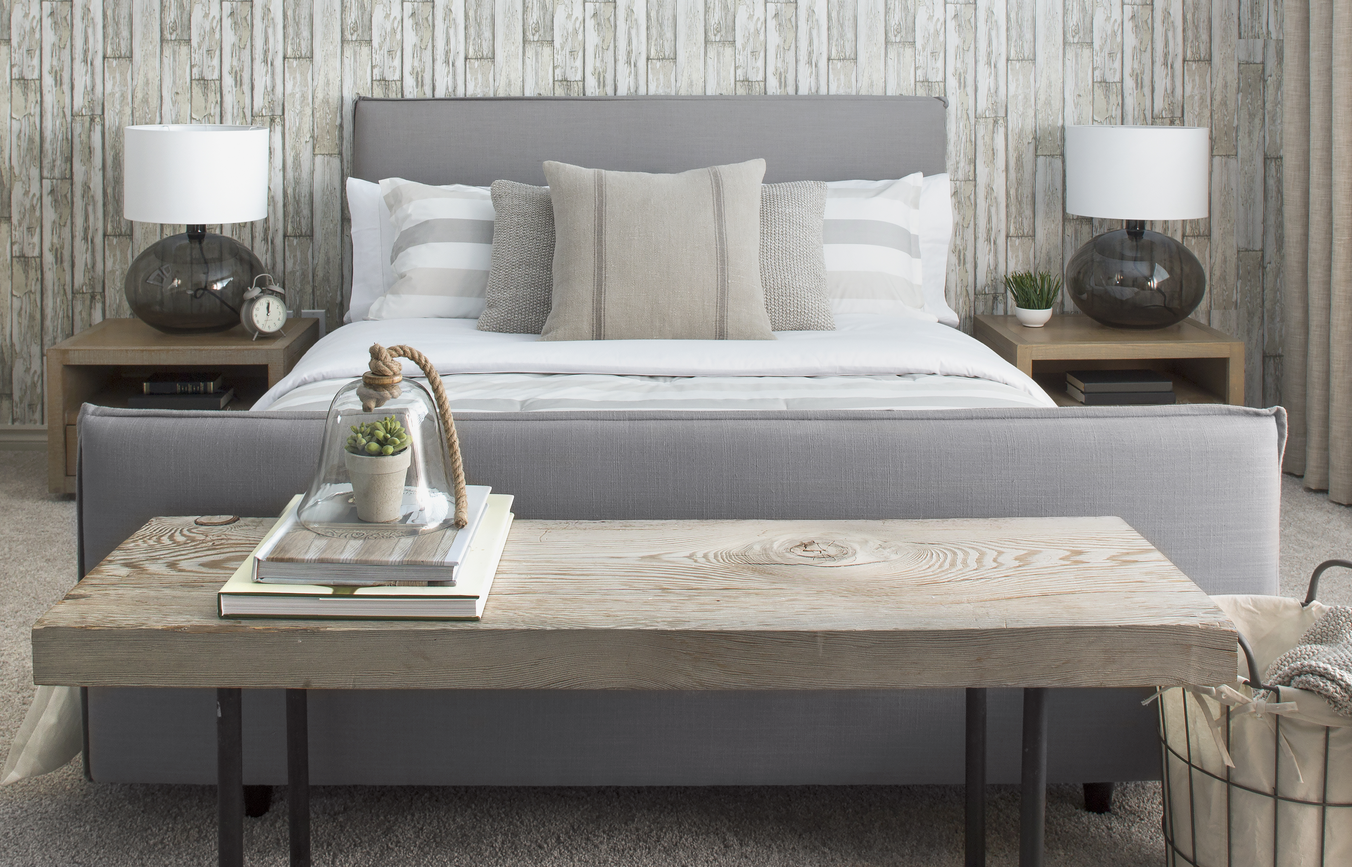 Elegant neutral bed and wood bench