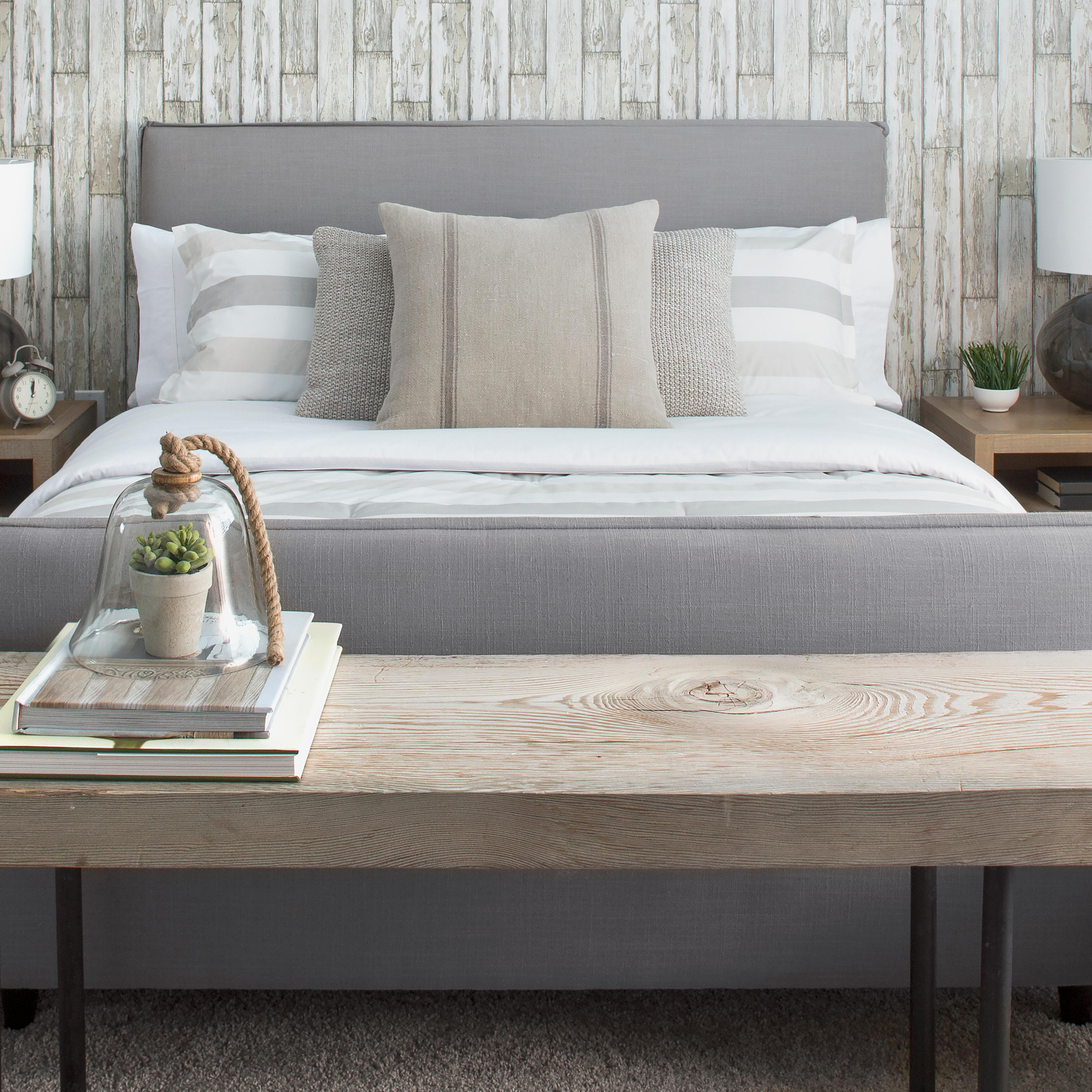 Elegant neutral bed and wood bench