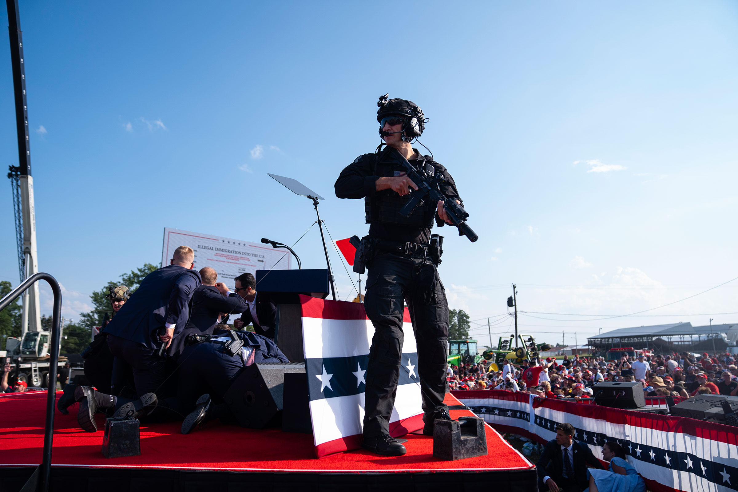 Republican presidential candidate former President Donald Trump is surrounded by U.S. Secret Service agents at a campaign rally in Butler, Pa., on July 13, 2024.