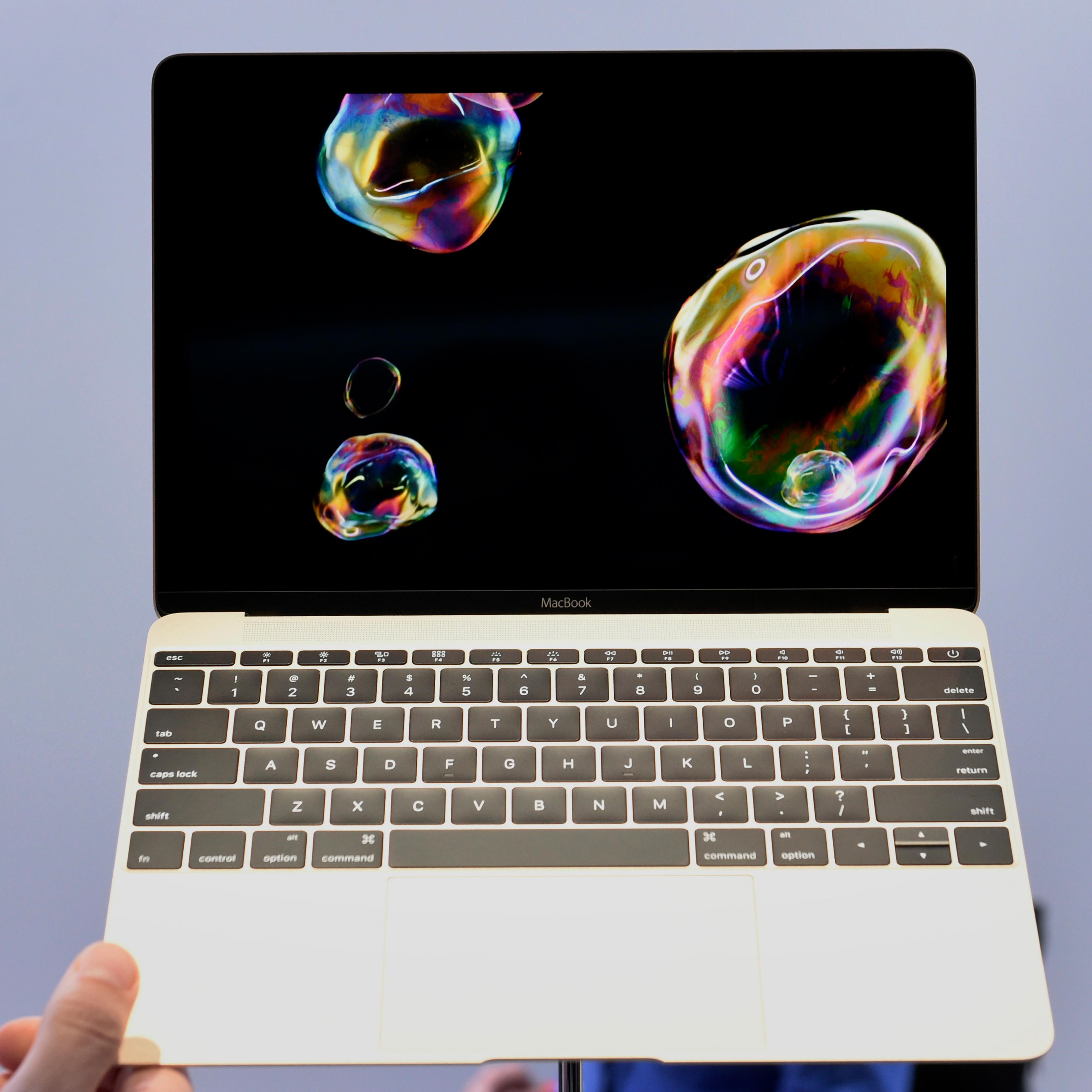 The new gold edition Macbook laptop is displayed during the Apple Inc. Spring Forward event in San Francisco, California, U.S., on Monday, March 9, 2015. Apple Inc. began showing off features and applications for its first new device in five years, a sma