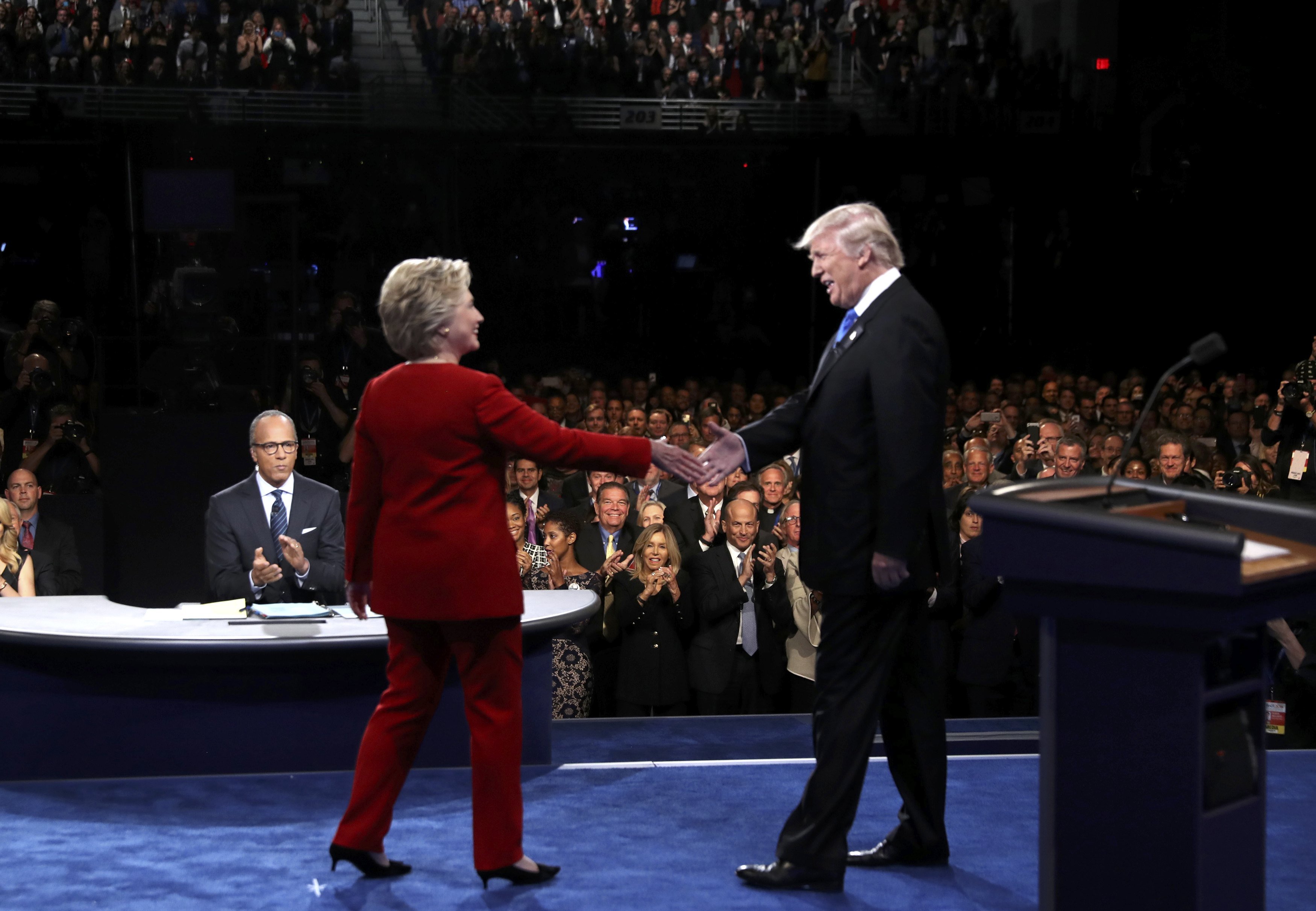 Republican U.S. presidential nominee Donald Trump shakes hands with Democratic U.S. presidential nominee Hillary Clinton at the start of their first presidential debate at Hofstra University in Hempstead