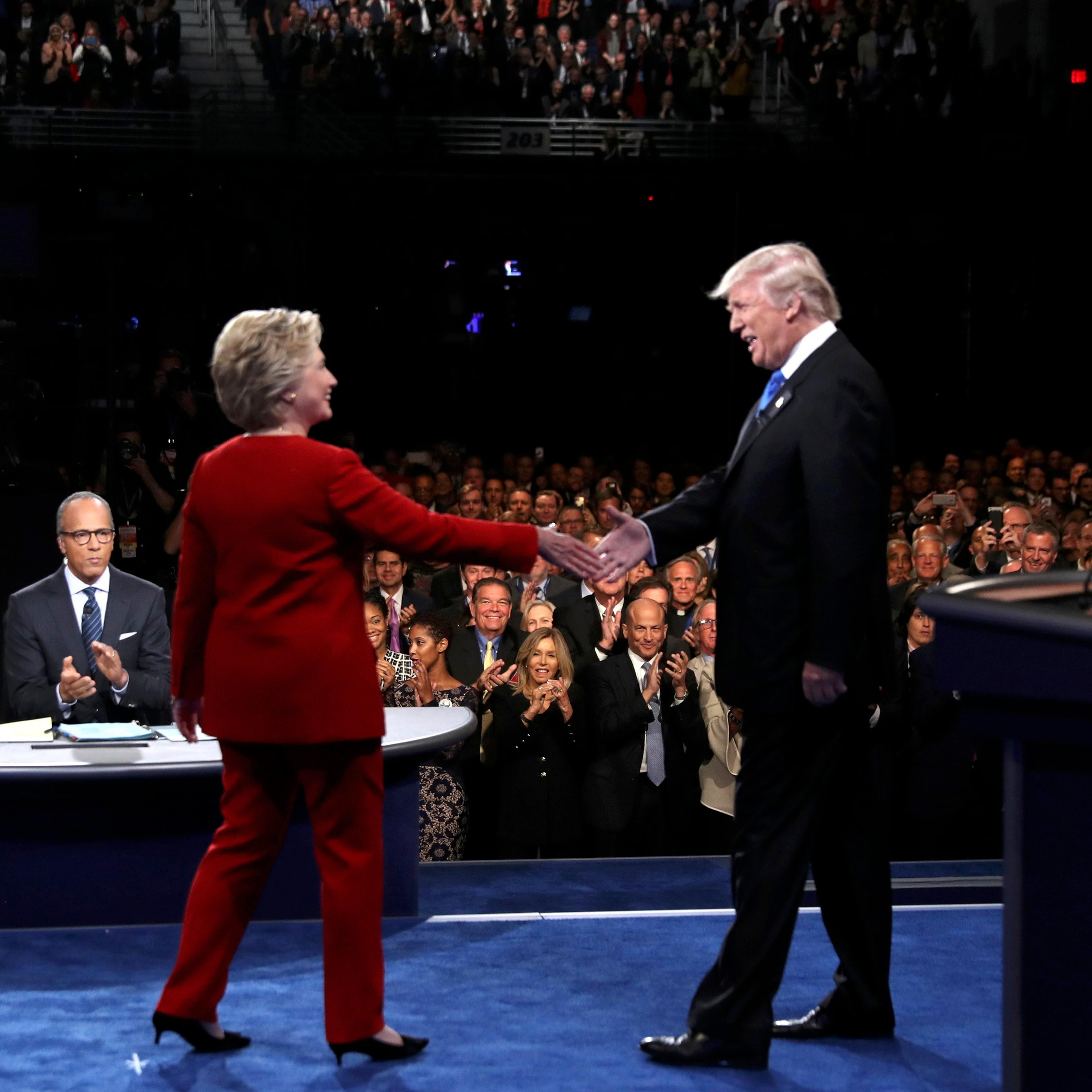 Republican U.S. presidential nominee Donald Trump shakes hands with Democratic U.S. presidential nominee Hillary Clinton at the start of their first presidential debate at Hofstra University in Hempstead