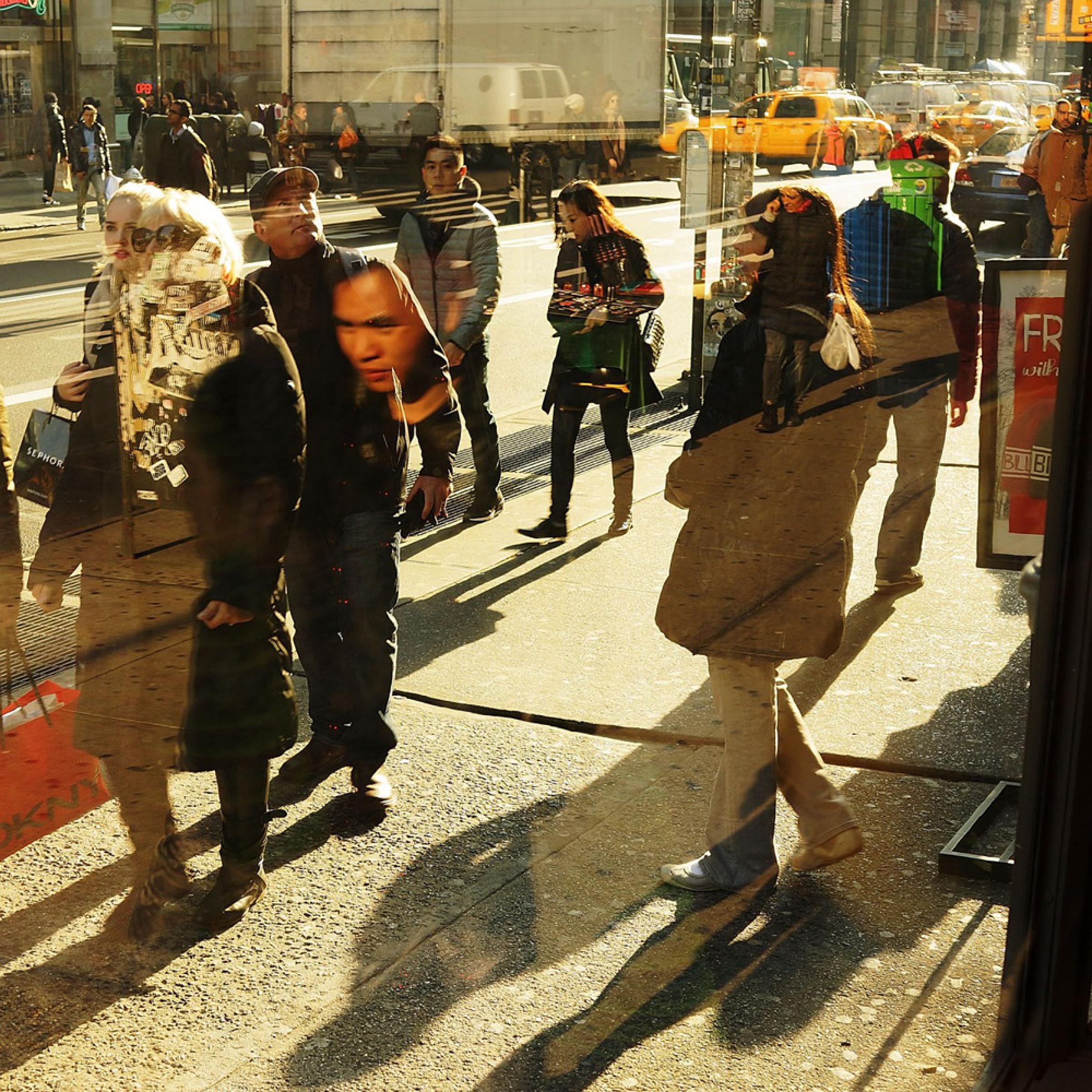 People walk along Broadway on December 2, 2013 in New York City.