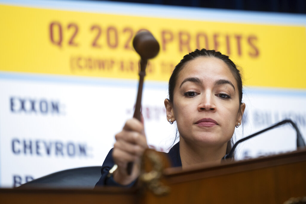Rep. Alexandria Ocasio-Cortez (D-N.Y.), filling in for Chair Carolyn Maloney (D-N.Y.), gavels out a House Oversight and Reform Committee hearing on alleged oil industry greenwashing and the impacts of climate change on Capitol Hill on Sept. 15, 2022.