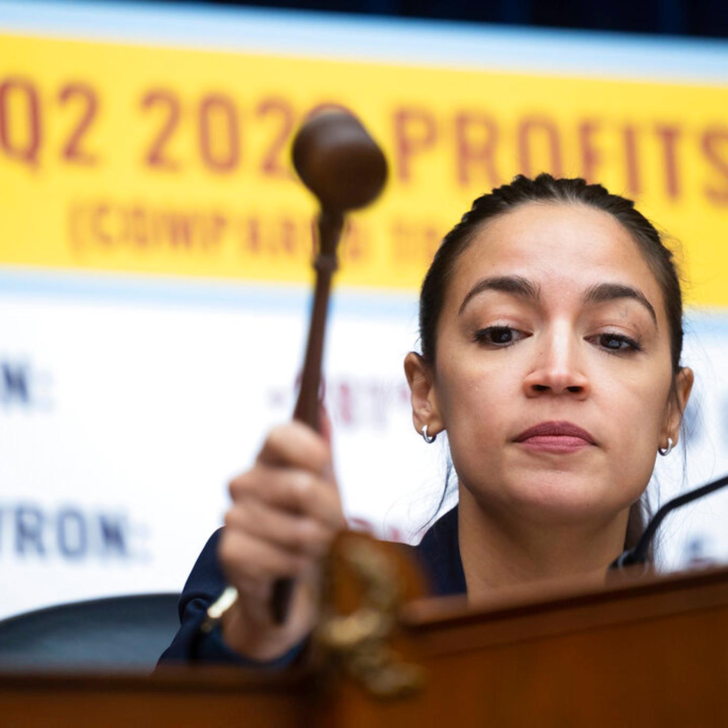 Rep. Alexandria Ocasio-Cortez (D-N.Y.), filling in for Chair Carolyn Maloney (D-N.Y.), gavels out a House Oversight and Reform Committee hearing on alleged oil industry greenwashing and the impacts of climate change on Capitol Hill on Sept. 15, 2022.