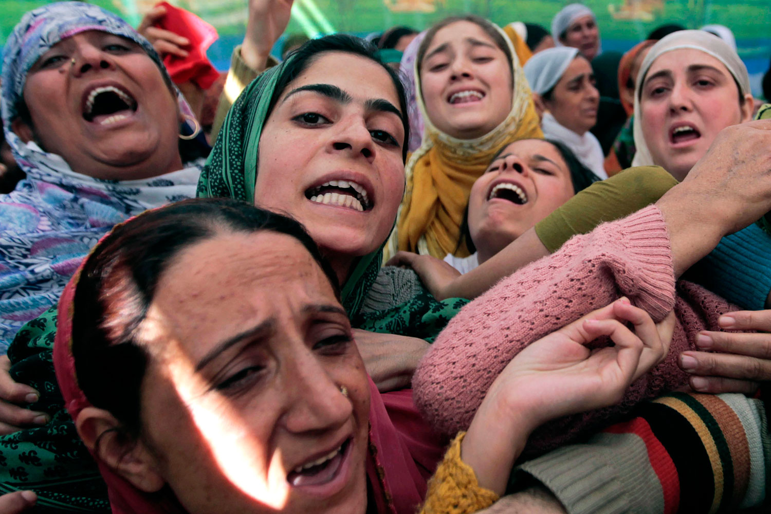 October 1, 2011. Mourners wail at the funeral of Haji Syed Mohammad Yousuf, a 61-year-old retired teacher in Indian-controlled Kashmir who died in police custody on September 30 after being arrested on suspicion of accepting bribes.