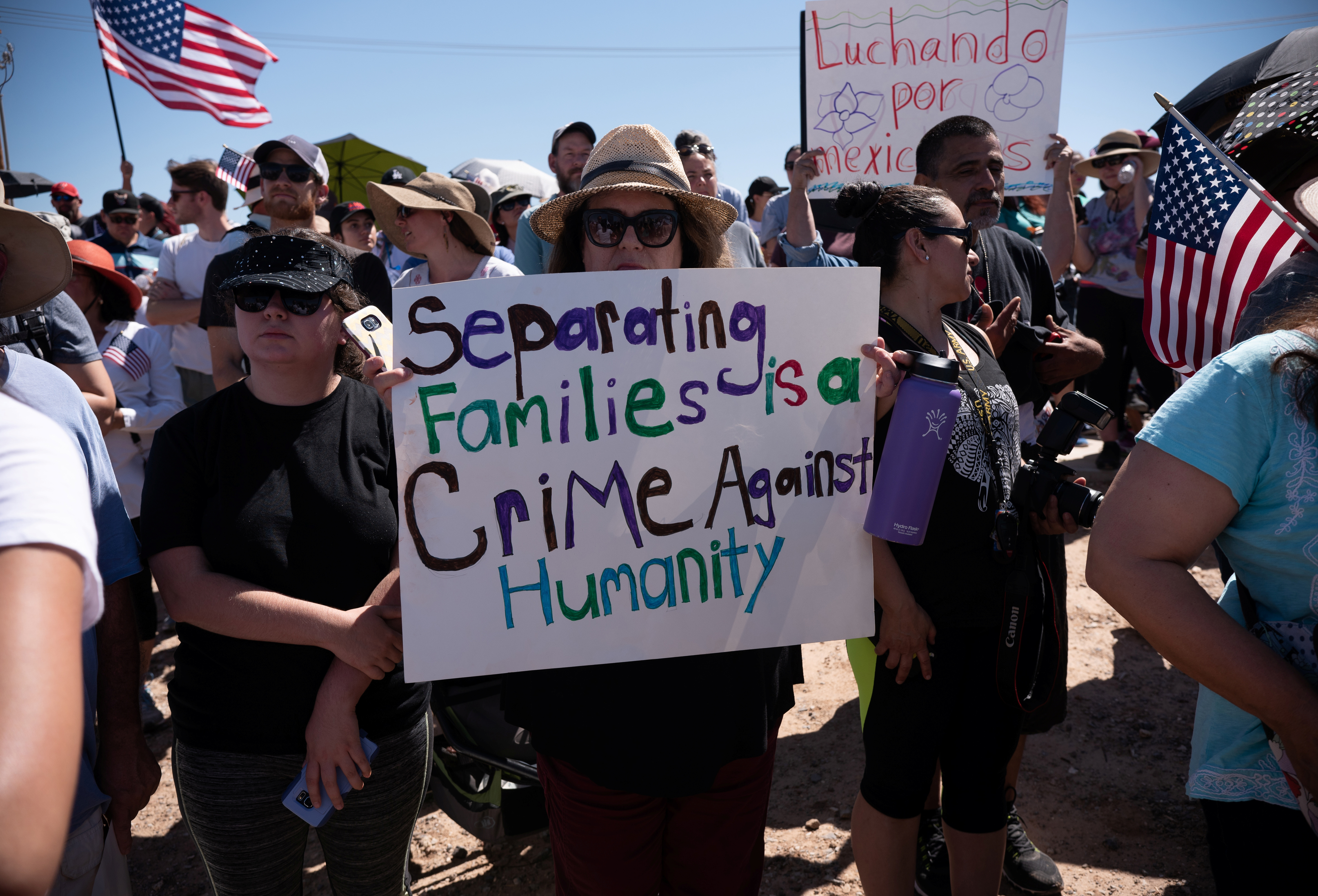 People participate in a protest against a recent U.S. immigration policy of separating children from their families when they enter the United States as undocumented immigrants, outside the Tornillo Tranist Center, in Tornillo