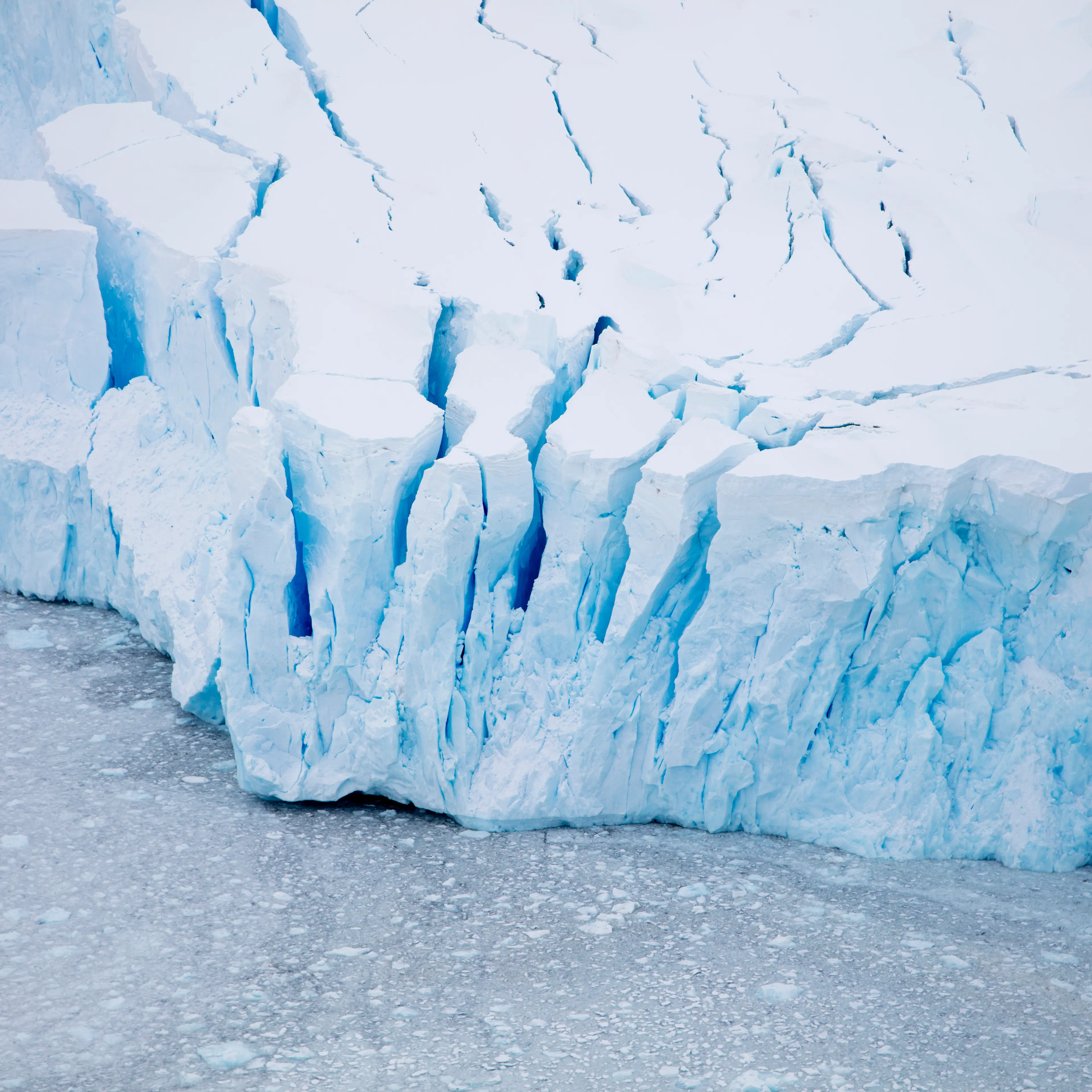 Overhead of glacier shelf with blue ice