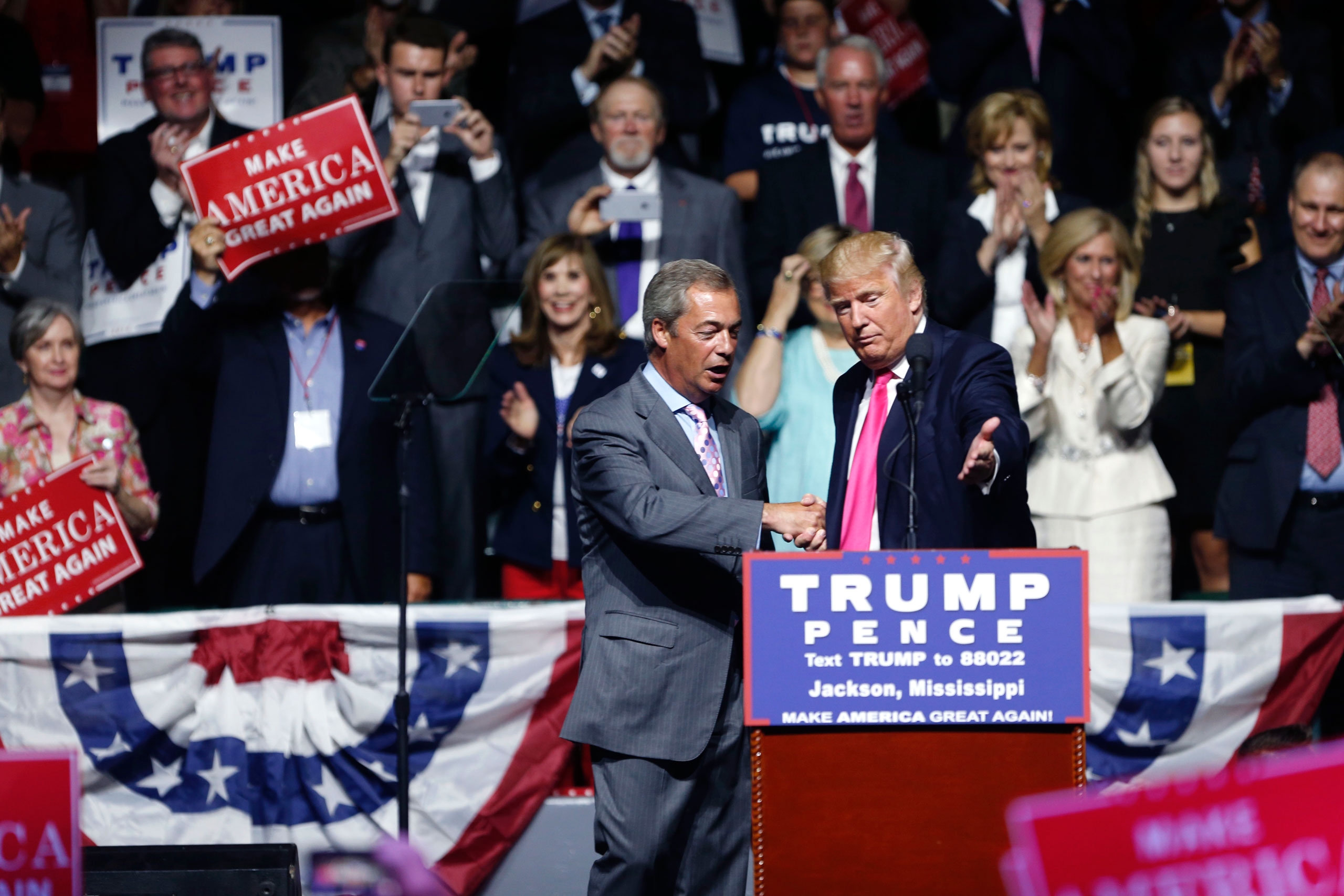 Republican presidential candidate Donald Trump welcomes Nigel Farage, ex-leader of the British UKIP party, to speak at a campaign rally in Jackson, Miss., Wednesday, Aug. 24, 2016. (AP Photo/Gerald Herbert)
