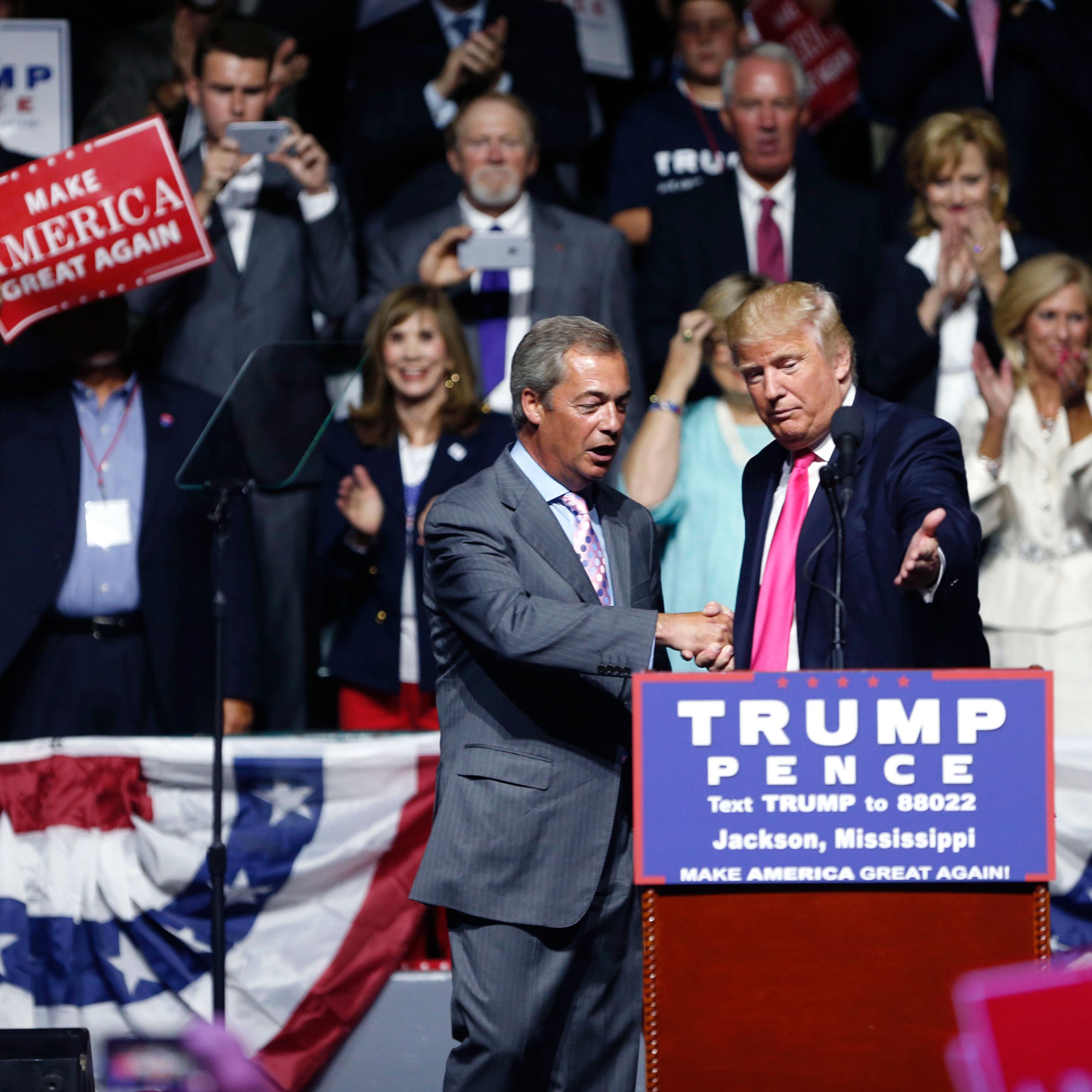 Republican presidential candidate Donald Trump welcomes Nigel Farage, ex-leader of the British UKIP party, to speak at a campaign rally in Jackson, Miss., Wednesday, Aug. 24, 2016. (AP Photo/Gerald Herbert)
