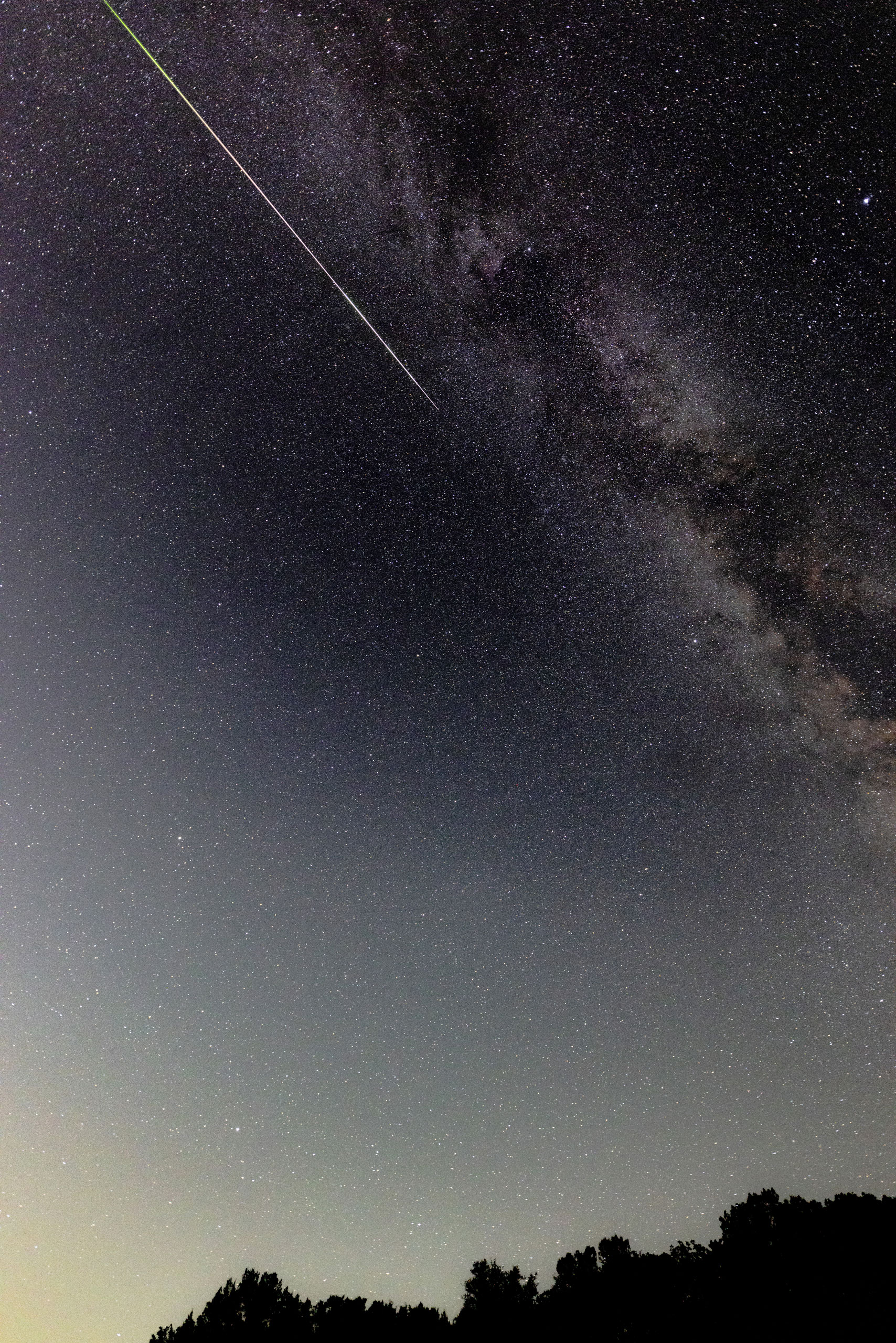 A meteor streaks across the sky during the Perseids meteor shower peak at Pedernales Falls State Park in Johnson City, Texas, on Aug. 12, 2024.