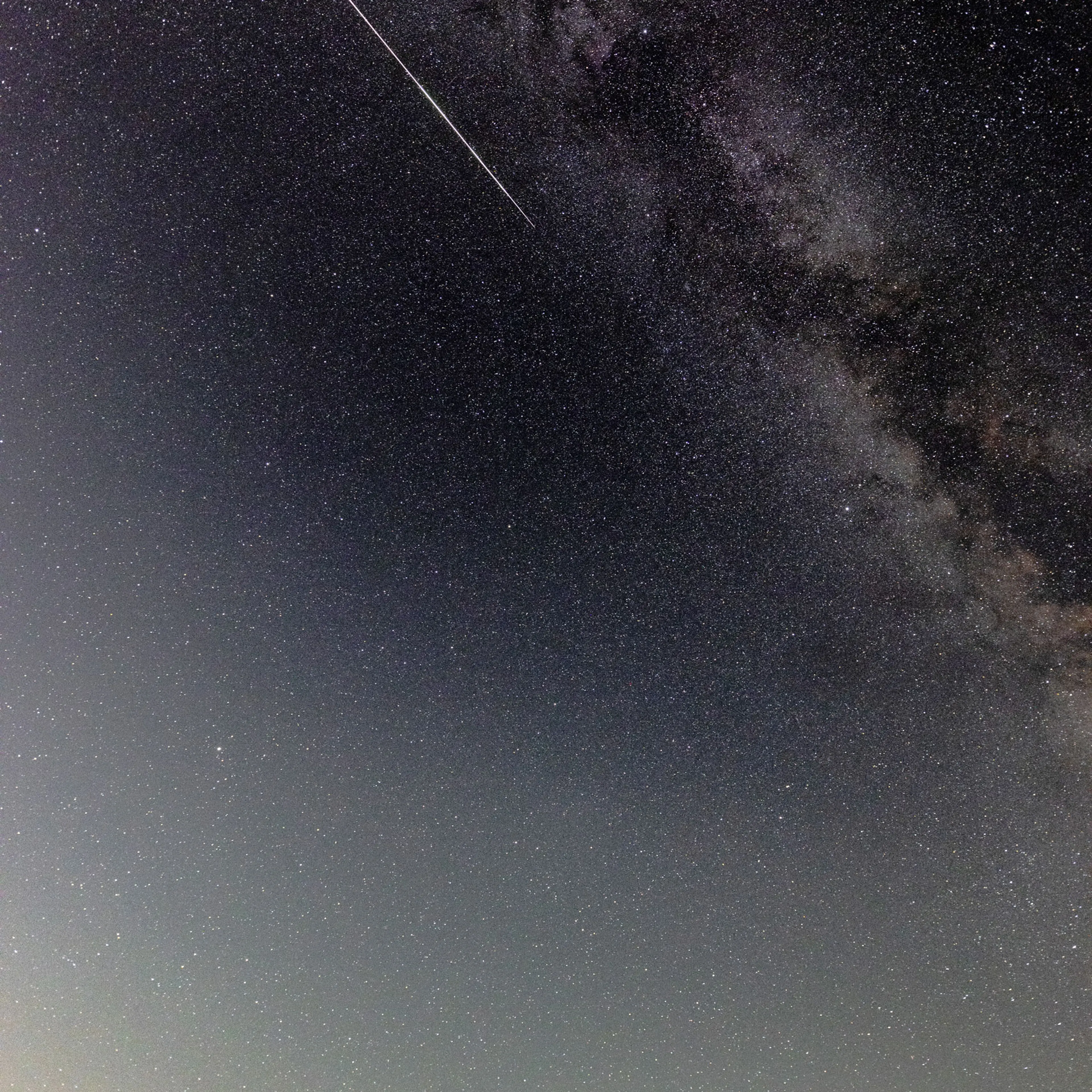 A meteor streaks across the sky during the Perseids meteor shower peak at Pedernales Falls State Park in Johnson City, Texas, on Aug. 12, 2024.