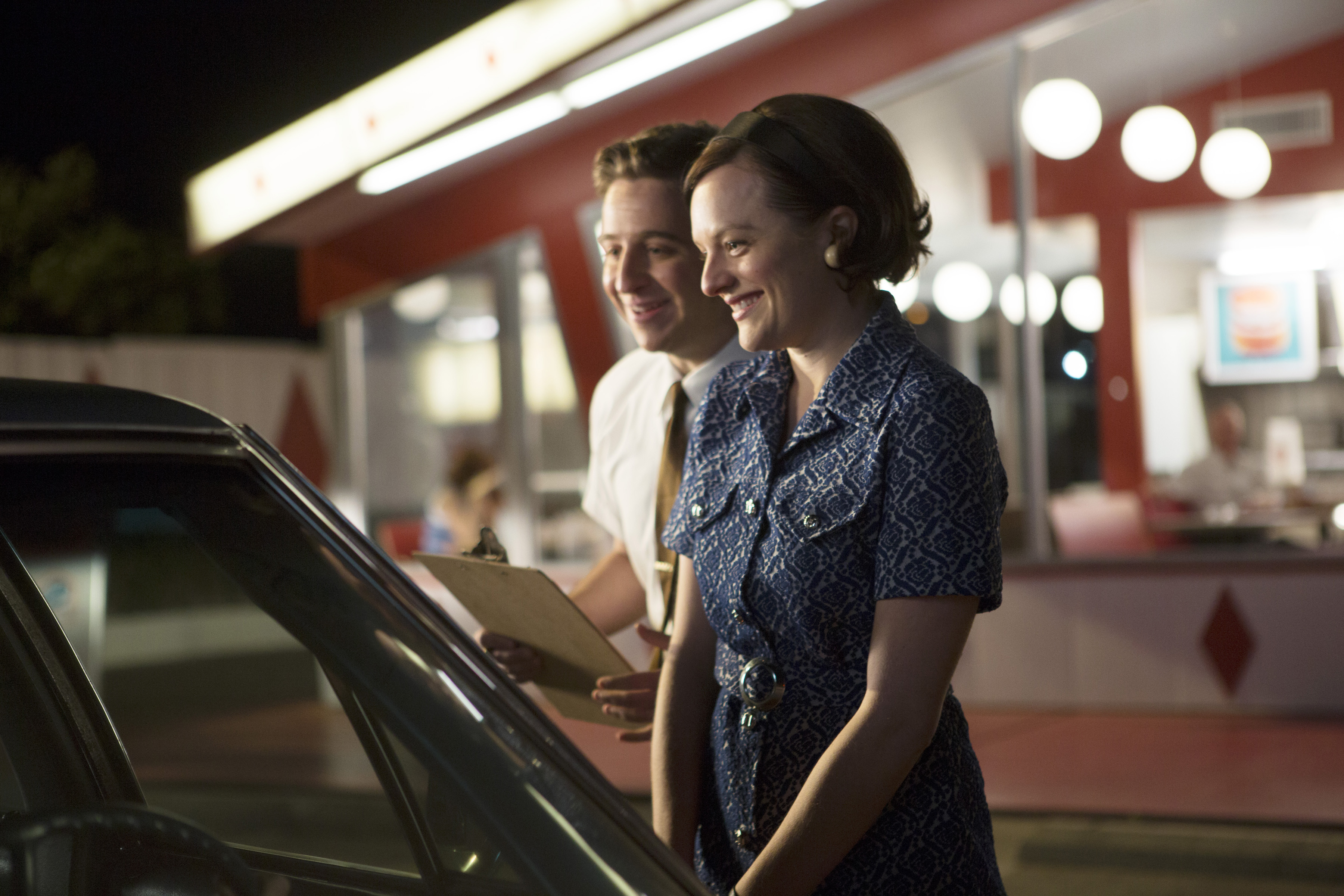 Trevor Einhorn as John Mathis and Elisabeth Moss as Peggy Olson - Mad Men _ Season 7, Episode 6 - Photo Credit; Justina Mintz/AMC